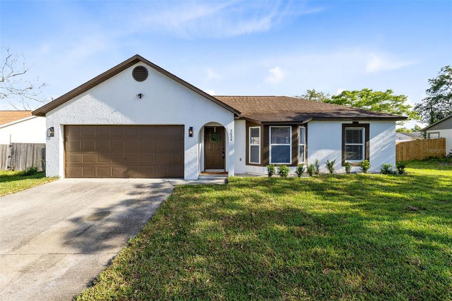 Welcome Home! This updated and well-maintained 3-bedroom, 2-bath home in Deltona offers a comfortable layout, thoughtful updates, and excellent value. Featuring an open floor plan with high ceilings, the main living areas feel bright and spacious, creating an inviting environment for everyday living and entertaining. The home has been tastefully updated with beautiful flooring throughout, giving it a clean, cohesive look. Many improvements have already been completed for peace of mind, including an A/C system in 2021, fresh interior and exterior paint in 2026, and a new septic drain field 2026. The kitchen and living spaces flow seamlessly together, maximizing functionality, and the split-bedroom layout offers a comfortable primary suite with an en suite bath and walk-in closet, plus two additional bedrooms. The garage provides ample parking and storage, and there is also an additional detached storage garage in the back, perfect for tools, equipment, hobbies, or extra storage needs. This is a great opportunity for a primary residence or an investment property. With an ideal location, just a short drive to major highways, airports, theme parks, and the beaches, this home is one you don't want to miss. Schedule your showing today!