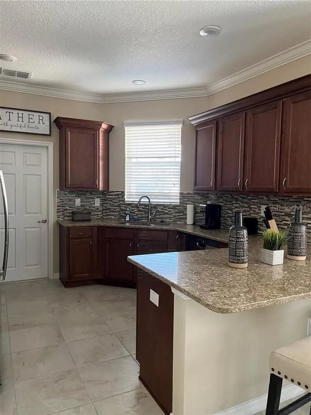 Photo of 9879 SW 99th Loop, Ocala, FL 34481 (MLS # OM721600)