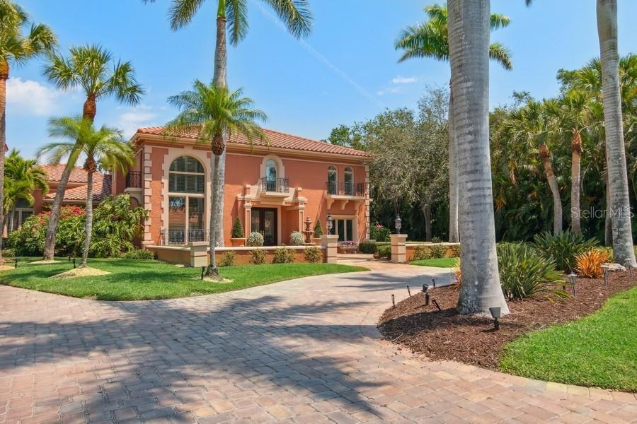 Majestic Southern European Style Estate in the heart of TPC Prestancia, one of the most private and gated golf communities in the Sarasota area.This elegant residence offers almost 6,000 square feet of luxurious living spaces split between the original home and the guest house built in 2012. Car lovers? The two garages have six spaces available to host your collection of cars, golf carts and cycles. This Estate should be featured in your favorite lifestyle magazines with details of luxury in every room: marble flooring, granite, onyx, travertine, precious wood ornament, mahogany, wrought-iron balconies, Appliances include Wolf oven, Miele coffee bar, multiple wine refrigerators throughout the property. From the inviting circular driveway framed by Royal Palms, a charming courtyard with a stone carved fountain welcomes you. Discover beyond the double leaded glass mahogany front door a heaven with comfort and privacy. Your eyes are caught immediately by the warm living room open to the pool and to the lushly landscaped backyard. What you can expect in the main residence is waiting for you: a sumptuous Master Bedroom Suite on the first floor, an exquisite Gourmet Kitchen where your guests can sip cocktails at the bar or relax in the family room featuring an eye-catching fireplace, office, formal dining-room, powder room, pool bath. A wrought iron railing leads to four bedrooms with wood flooring, and two bathrooms on the second floor. In addition, the residence offers ample spaces that can accommodate storage, a gym and extra storage in the custom cabinetry in both garages. A kennel area has also been designed to accommodate your furry members. This Italian-Spanish fusion architecture is truly expressed in the pool patio and in the courtyard with the sculptures on the wall, the lanterns, the wooden rounded doors, and the small nooks to relax on a lounge chair. Entertain your family and guests with a dinner “al fresco” prepared in the outdoor kitchen; your friends won’t leave as it is such a pleasure to enjoy the pool, to contemplate the golf course or to simply play or wander through the paths of the park like backyard as the property sits back on one of the largest lots of Prestancia, on the 15th hole of the Players golf course. Your guests will be delighted to stay in the spacious guest house, 1500 square foot extremely comfortable with a kitchen open to the living room, an ensuite bedroom and a bonus room with multiple possible uses: bedroom, gym... The golf course views are breathtaking; why not have breakfast on the balcony? This mansion is located minutes away from the pristine beaches of the Gulf of Mexico (Siesta Key, Nokomis….) to the Sarasota downtown with its theaters and Opera House, fine dining, upscale shopping, and Sarasota airport. Bike, jog or enjoy two 18th golf courses at TPC Golf Club (several memberships are available and optional) and make new friends in this vibrant community.. You belong here.