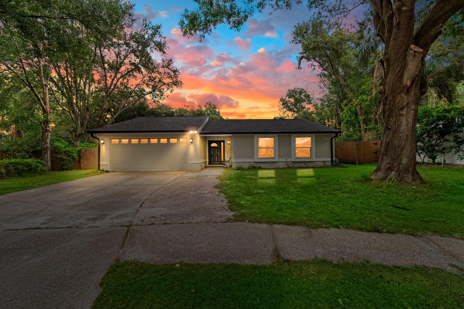 Come see this beautiful home with many updates, including new roof, new AC, and new hot water heater! Fresh paint, recently trimmed trees, and new lanai screens truly make this house move in ready! The kitchen features custom wood cabinets, granite counter tops and under mount stainless steel sink with pull out faucet. All stainless-steel appliances include a large side by side fridge. The fenced in backyard, screened in lanai, patio and pool make this ideal for entertaining! Ceiling fans in all rooms. No carpet, laminate and tile floors give the home a clean feel. Every window has been updated with energy star efficient windows. No HOA fees in cul de sac, location is key!