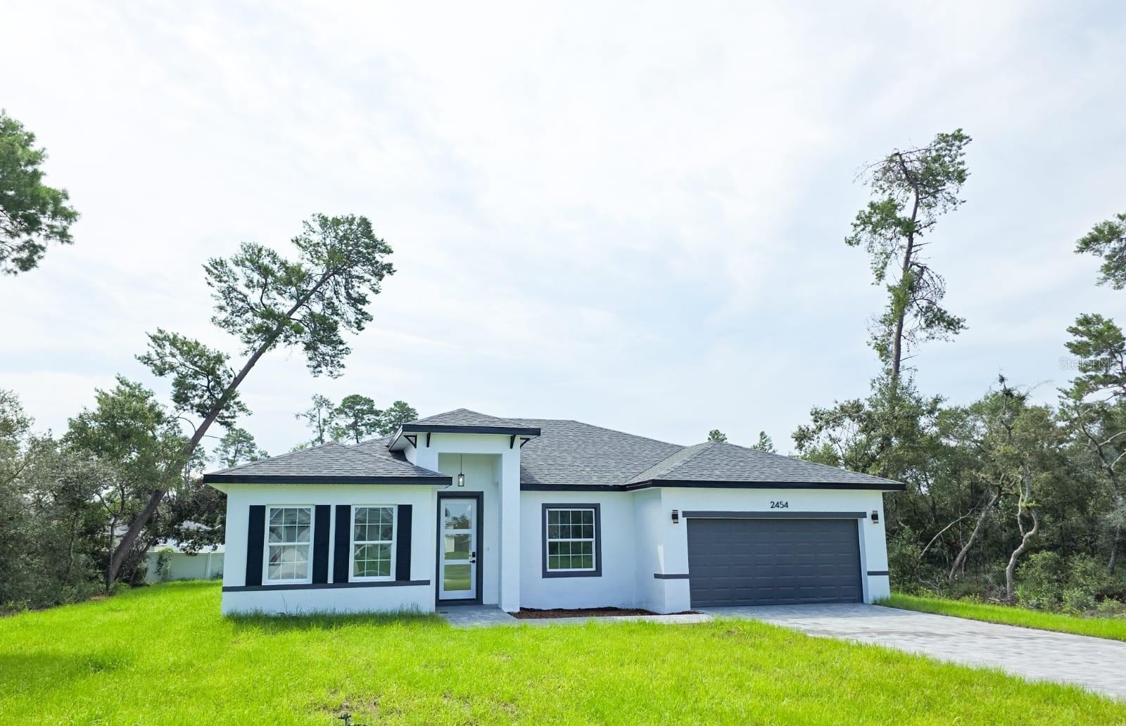 Stunning New Construction Home in Prime Ocala Location
Experience the perfect combination of modern design and everyday comfort in this brand-new ranch-style home located in one of Ocala’s most sought-after neighborhoods. Featuring 4 spacious bedrooms with ample closet space and 2 well-designed bathrooms, this home is ideal for families seeking both functionality and style.
The open-concept floor plan seamlessly connects the living, dining, and kitchen areas — perfect for entertaining or relaxing. The kitchen includes quartz countertops, a central island, pantry, and modern appliances, creating a stylish and practical cooking space. Durable luxury vinyl flooring flows throughout, adding elegance and easy maintenance.
Additional features include a welcoming front porch, sliding glass doors that brighten the home and open to the backyard, a dedicated laundry room, and a spacious two-car garage with an electric door and remote access. Sidewalk-lined streets enhance the neighborhood’s charm, and a one-year builder’s warranty provides added peace of mind.
Don’t miss your chance to own a new construction home that delivers quality, comfort, and convenience in the heart of Ocala. Schedule your private tour today!