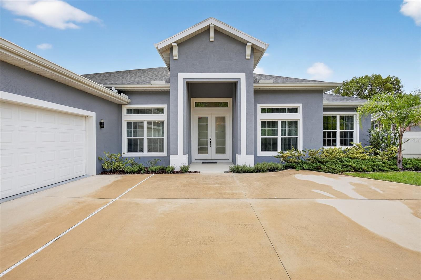Experience the best of modern Florida living in this custom 4-bedroom, 3-bathroom residence, nestled on a quiet cul-de-sac in one of Palm Coast’s most beautiful neighborhoods. Built just 3 years ago, this home blends timeless elegance with the convenience of new construction.
Step through the grand entrance and be greeted by soaring ceilings and 8-ft doors, creating an atmosphere of sophistication and space. The open-concept design flows seamlessly from the designer kitchen with premium finishes into expansive living and dining areas, perfect for both intimate gatherings and large-scale entertaining.
The owner’s suite is a private retreat, complete with a spa-inspired bathroom and a generous walk-in closet. Three additional bedrooms and two full bathrooms provide luxurious accommodations for family or guests.
Situated on a quiet cul-de-sac, this property offers privacy and tranquility, while remaining just minutes from pristine beaches, world-class golf, dining, and shopping. The neighborhood itself is one of Palm Coast’s most desirable, offering both elegance and community charm.