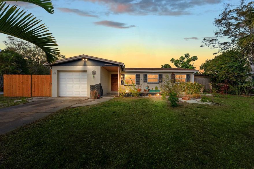 Your Private Lakefront Oasis Awaits! Welcome to this beautifully updated 3/1 lakefront home on an over-sized lot. Step into an exceptional backyard retreat featuring a fully fenced yard with peaceful lake views. This outdoor space perfect for relaxing, entertaining, or simply soaking in the scenery. Enjoy the covered patio surrounded by mature trees and lush landscaping. Whether you’re fishing, kayaking, paddleboarding, or gardening in the fertile soil, this backyard truly sets the home apart. Inside, the newly renovated open-concept kitchen shines with granite countertops, ample cabinetry, and stainless-steel appliances (stove, refrigerator, dishwasher, microwave). Recessed lighting with dimmers and a pass-through bar connect the kitchen to the Florida room, all while framing stunning views of the backyard. The updated bathroom impresses with new tile, fixtures, toilet, upgraded ventilation, and lighting, plus a large adjacent storage closet for added convenience. Additional highlights include central A/C and heat, garage, storage shed, all appliances included, outdoor outlets, water access, and gutters throughout. Ideally located near Blanton Elementary, parks, churches, sports facilities, farmers markets, shopping, and dining, with walking access to parks and quick routes to Downtown St. Pete and the beautiful Gulf Beaches. Come check out your new home!