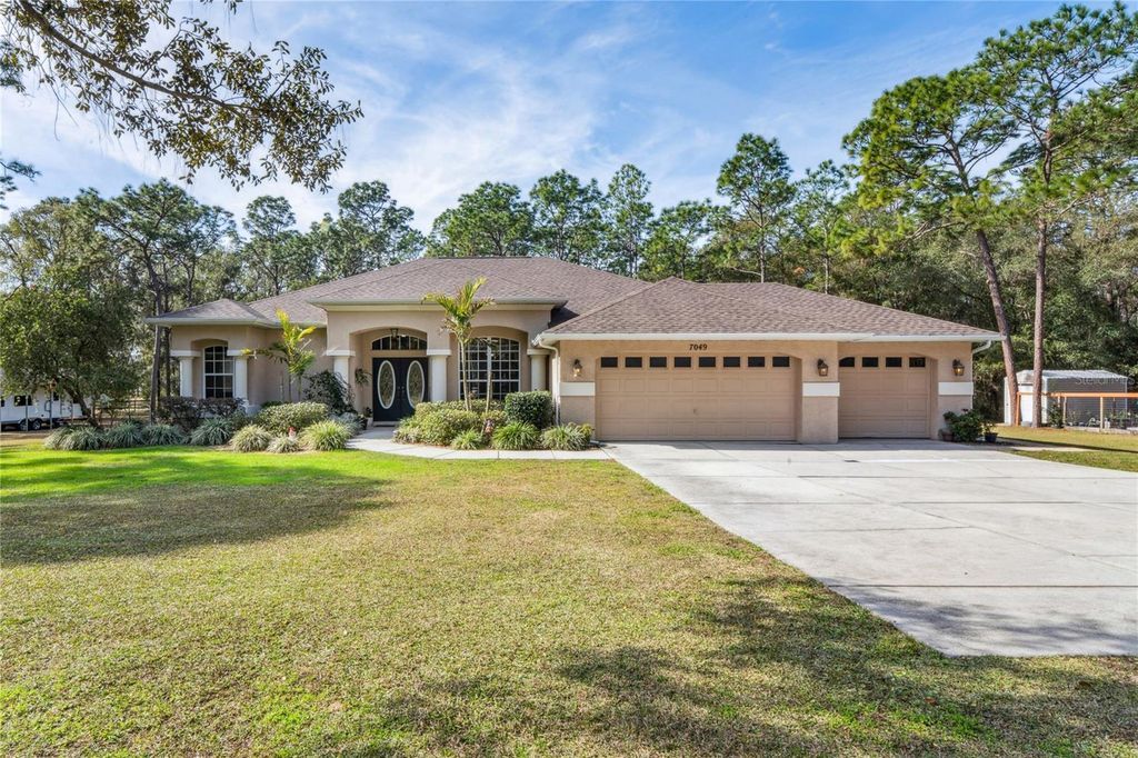 Photo of 7049 Poppas Pass, Brooksville, FL 34602 (MLS # TB8462041)