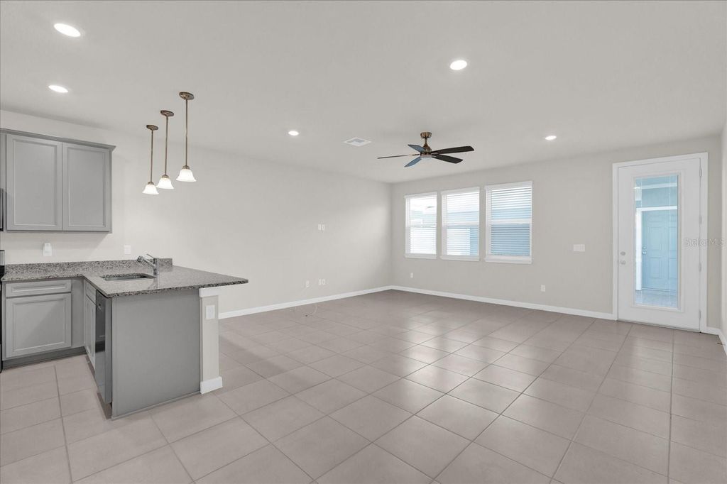 Photo of 10877 Wooded Acre Alley, Orlando, FL 32829 (MLS # O6388988)