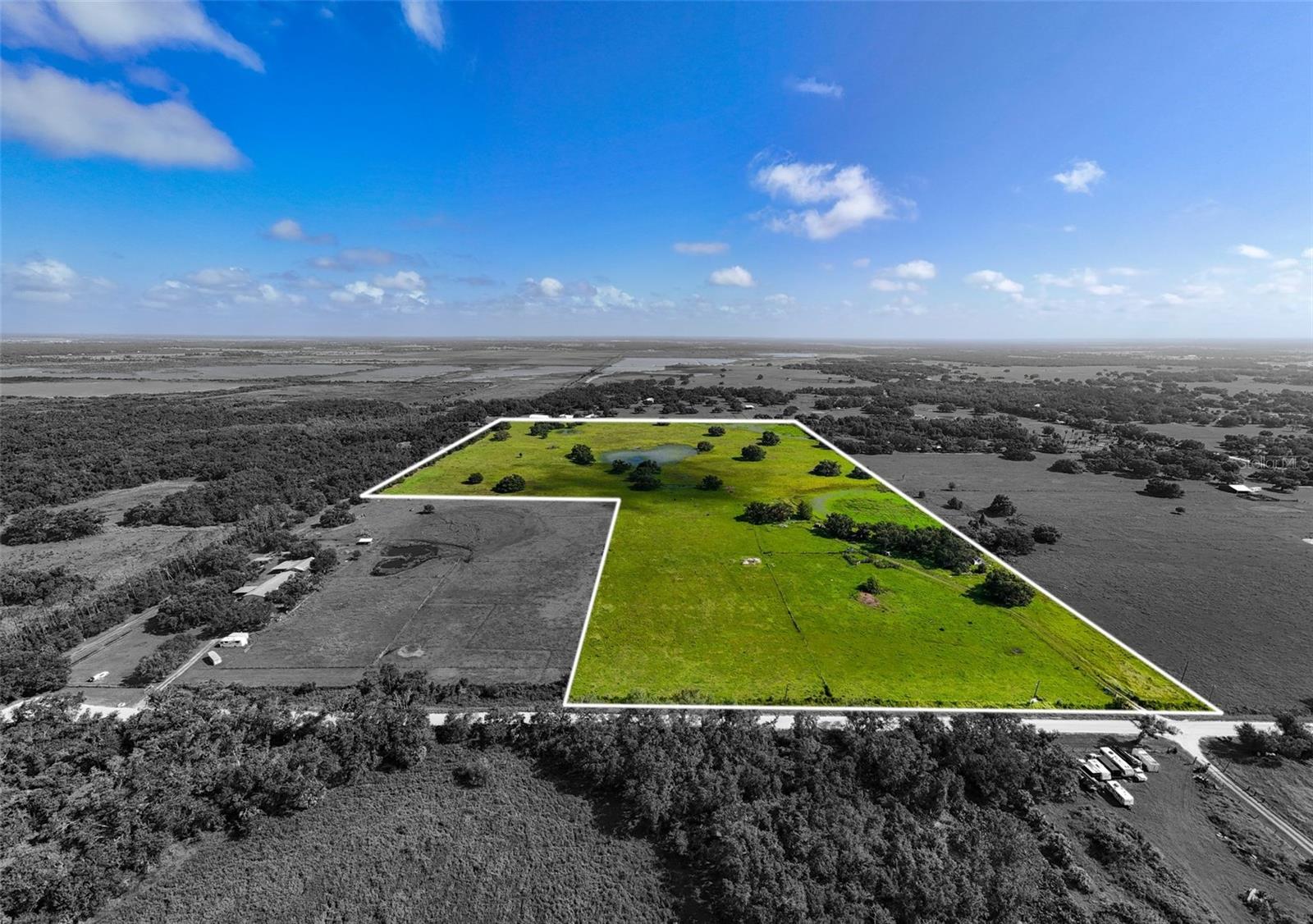 Discover 47 acres of pristine agricultural land nestled at the end of scenic River Road in Myakka City, just moments from the new Soleta Golf Club and within a 20 minute drive to the vibrant community of Lakewood Ranch. There is a 1,000 sq ft home currently on the property but is in bad condition and needs complete renovation or removal. This property is also being marketed as vacant land. Currently the property has a cattle lease that may convey to the new owner and is a benefit for agricultural tax exemptions. The land is well-suited for any agricultural use while offering incredible potential for future development. With no HOA or deed restrictions, you have the freedom to build your dream homestead—whether that’s a custom farmhouse, a modern barndominium, or a fully equipped workshop. There are 2 existing wells and power already in place so construction costs will be eased. The property allows for a primary residence and up to three accessory dwelling units (ADUs), or alternatively it can be subdivided to suit your plans. Mineral rights convey with the sale, and while the majority of the land lies in Flood Zone X (high & dry), there are three small areas of wetlands that provide a seasonal water source for livestock. This vacant land offers a rare opportunity to disconnect from the fast pace of city life without sacrificing access to everyday conveniences. The drive to the property winds through old Florida county roads, offering a peaceful and scenic entry that feels like stepping into a simpler time. Plus, with county plans to pave River Road in the future, accessibility and property value are poised to grow. Whether you're looking to establish a working ranch, a private country estate, or a long-term investment, this versatile property is a true blank canvas ready for your vision.