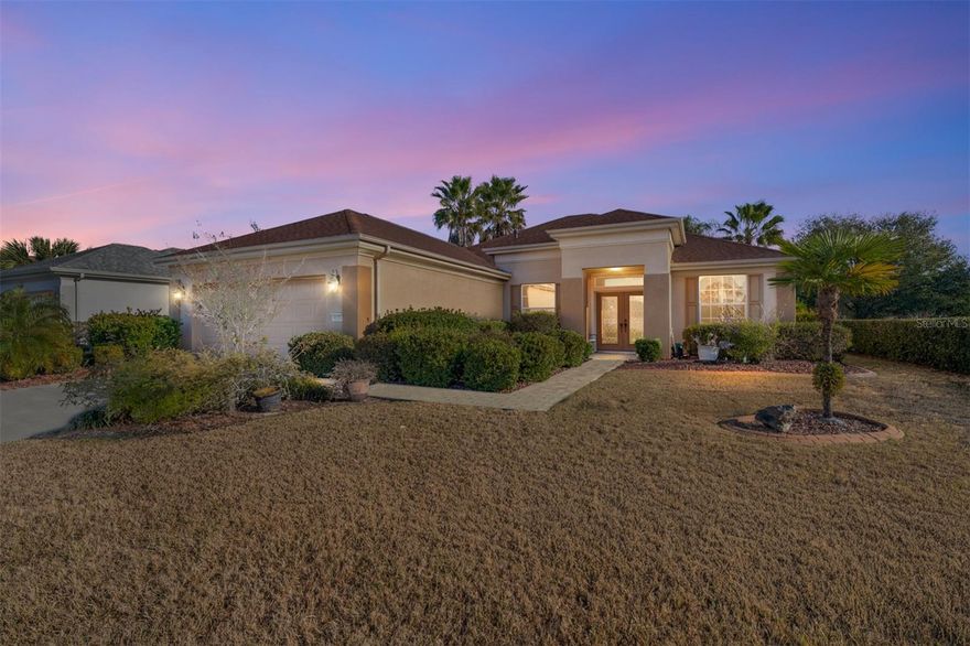 First time on the market! This highly sought-after Johnstown model with 3 bedrooms plus a study/den is beautifully positioned just off the green of the 4th hole on the Masters Golf Course — and less than 100 yards from both a chipping green and a separate putting green to sharpen your game. From the moment you arrive, you’ll appreciate the pavered walkway, curbed rock beds, and elegant leaded glass double entry doors. Inside, the open great room design includes a dedicated dining area, with the kitchen perfectly positioned to remain part of every gathering. The kitchen offers oak cabinetry, an island, breakfast bar, solar tube, and mostly updated appliances, including a French-door refrigerator with bottom freezerReal wood flooring enhances the great room and hallway. The primary bedroom features engineered wood flooring, while the two guest bedrooms and study are comfortably carpeted. Ceiling fans with lights are found throughout the home. The enclosed lanai showcases floor-to-ceiling acrylic windows, creating a bright and relaxing space to enjoy the golf course setting.The primary bath has been updated with new shower walls, glass enclosure, and a bench seat. The extended 28-foot garage includes pull-down attic stairs for extra storage and convenient keyless entry.Major updates include a new roof in 2021 and HVAC in 2018. This home has been meticulously maintained and is truly move-in ready. Some furniture is available for purchase.A rare opportunity to own one of Del Webb’s favorite models in a prime golf course location — this is a home you must see to fully appreciate. Primary bedroom is virtually staged,