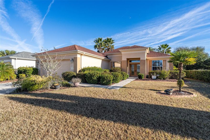 First time on the market! This highly sought-after Johnstown model with 3 bedrooms plus a study/den is beautifully positioned just off the green of the 4th hole on the Masters Golf Course — and less than 100 yards from both a chipping green and a separate putting green to sharpen your game. From the moment you arrive, you’ll appreciate the pavered walkway, curbed rock beds, and elegant leaded glass double entry doors. Inside, the open great room design includes a dedicated dining area, with the kitchen perfectly positioned to remain part of every gathering. The kitchen offers oak cabinetry, an island, breakfast bar, solar tube, and mostly updated appliances, including a French-door refrigerator with bottom freezerReal wood flooring enhances the great room and hallway. The primary bedroom features engineered wood flooring, while the two guest bedrooms and study are comfortably carpeted. Ceiling fans with lights are found throughout the home. The enclosed lanai showcases floor-to-ceiling acrylic windows, creating a bright and relaxing space to enjoy the golf course setting.The primary bath has been updated with new shower walls, glass enclosure, and a bench seat. The extended 28-foot garage includes pull-down attic stairs for extra storage and convenient keyless entry.Major updates include a new roof in 2021 and HVAC in 2018. This home has been meticulously maintained and is truly move-in ready. Some furniture is available for purchase.A rare opportunity to own one of Del Webb’s favorite models in a prime golf course location — this is a home you must see to fully appreciate. Primary bedroom is virtually staged,