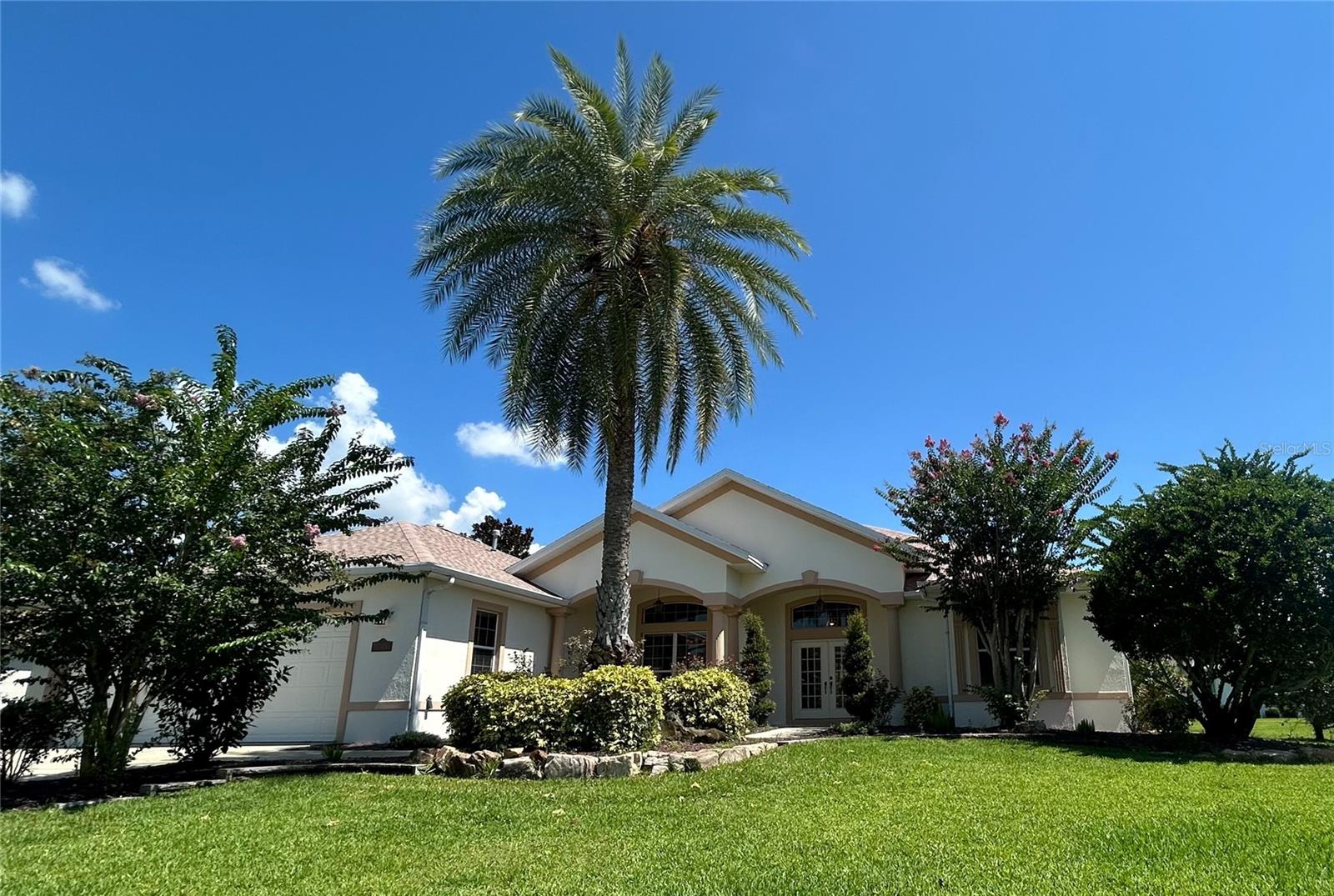 One or more photo(s) has been virtually staged. Welcome to this elegant PREMIER CHATHAM MODEL home in the desirable SUNSET RIDGE at SUNSET POINTE. With endless potential in a TOP-TIER LOCATION, it's your chance to update to your taste and unlock the value. This 3-bedroom, 2.5-bath home offers over 3,600 sq ft of living space, mature landscaping, and a charming front porch. Step through the foyer to discover HIGH KNOCK-DOWN CEILINGS and graceful architectural details.
The chef’s kitchen features GRANITE COUNTERTOPS, a LARGE PANTRY, and a ceiling fan to keep cool while cooking. Just off the kitchen, you'll find a spacious living room featuring rich wood flooring and a stylish tray ceiling, along with a flexible bonus room—perfect as a home office or game room—complete with a half bath. The primary suite boasts a TRAY CEILING, en suite bath with a GARDEN TUB & TILED SHOWER, DUAL SINKS, and an extra-large walk-in closet. The OVERSIZED third bedroom has two closets and easy access to a bath with a walk-in tub—perfect for an in-law suite. The second bedroom is spacious with a cozy window seat.
Enjoy a brick-paved, partially covered courtyard with a screened birdcage. The OVERSIZED LAUNDRY ROOM has abundant space for storage and organization. Plenty of room in the EXTRA-DEEP 2 CAR + GOLF CART GARAGE featuring HIGH CEILINGS and EPOXY FLOORS—perfect for large SUVs and golf carts. Additional highlights include central vacuum, MAGIC STAIRS, WATER SOFTENER, 2021 HVAC, and a BRAND NEW ROOF, with 22 FULLY PAID NEW SOLAR PANELS— great for golf cart and EV charging! The average electric bill is just $30–$35/month! All this, just minutes from Sunset Pointe Recreation Center, Lake Miona Pool, Pelican & Heron Golf Courses, and Lake Sumter Landing Market Square.