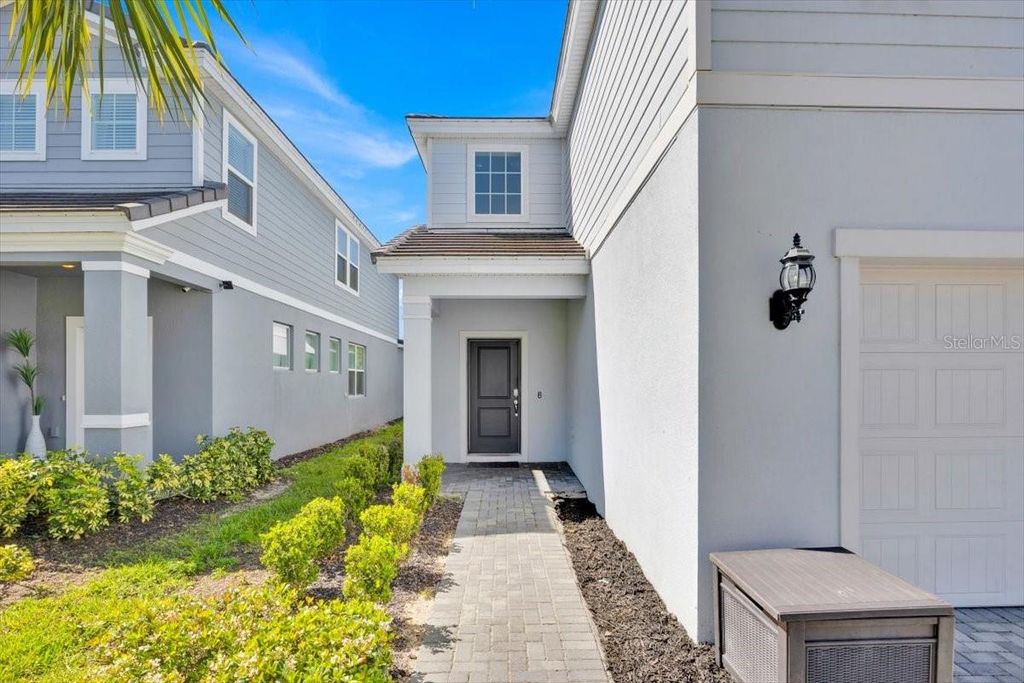 Photo of 7387 Oakmoss Loop, Davenport, FL 33837 (MLS # O6384353)