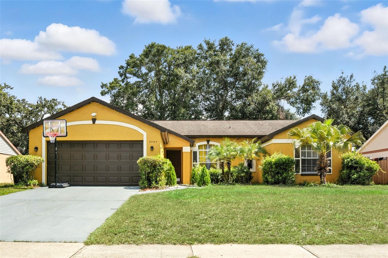 Looking for your next family home- THIS IS IT! This three-bedroom, two bathroom home has an open floor plan, granite countertops, a formal AND informal living room connected to a HUGE screened patio. The kitchen has a breakfast nook, 2 pantries, 42 inch cabinets and stainless steel appliances. The primary bedroom is on one side of the home with a nice walk-in closet, a double vanity bathroom, water closet for privacy and a renovated shower. The two guest rooms share a modern bathroom and are very spacious. Throughout the property you'll find laminate and luxury vinyl plank flooring to make cleaning a breeze. This property also has an attached two-car garage, so that your family will beat the heat and Florida showers. This beautiful home has gorgeous landscaping and a fully fenced backyard. Contact us today for a showing.