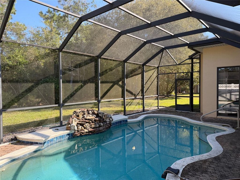 Photo of 31 Woodhollow Lane, Palm Coast, FL 32164 (MLS # O6398377)