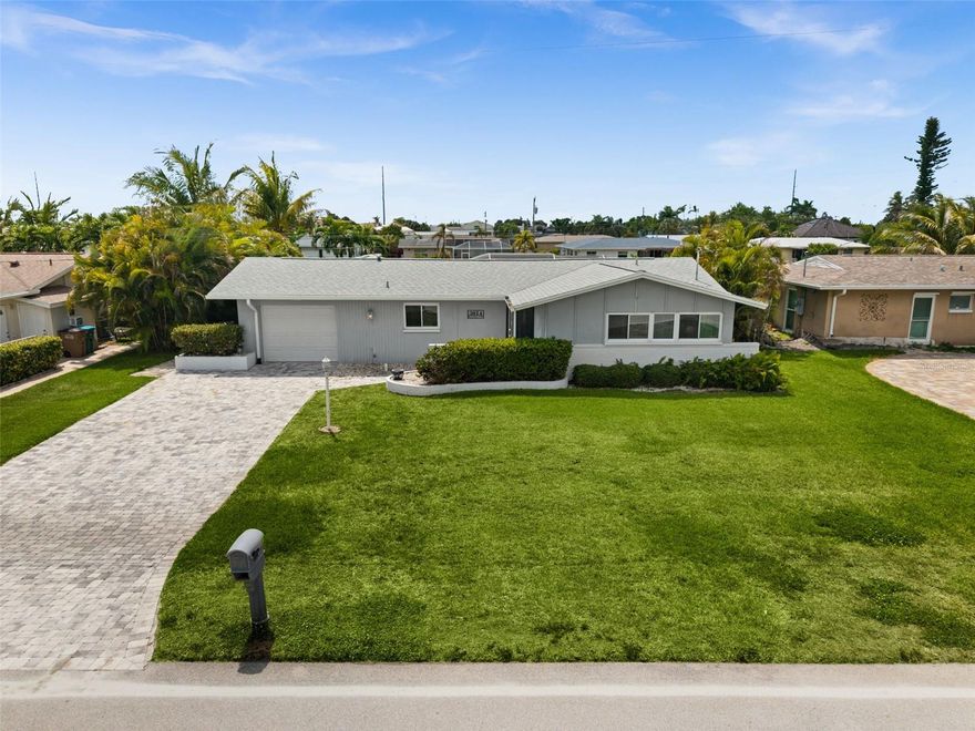 DIRECT SAILBOAT GULF ACCESS WITH NO BRIDGES TO OPEN WATER! Welcome to 3014 SE 17th Ave, a 3 bedroom, 2 bath waterfront pool home in Cape Coral’s desirable Cornwallis subdivision. This home is TURNKEY and offers a split-bedroom floor plan, all tile flooring throughout, and a prime boating location with quick access to open water.

The waterfront setup includes a composite dock with a 7,000 lb boat lift and canopy, making it easy to keep your boat right in the backyard. WESTERN EXPOSURE brings beautiful afternoon sun and evening skies over the water, while the HEATED POOL, huge screened lanai, paver pool deck, and private backyard create the perfect space for relaxing or entertaining.

Inside, the open floor plan features an updated kitchen with plenty of counter space, a breakfast bar, glass tile backsplash, and a light coastal feel. Both bathrooms have been updated, and the primary suite includes an ensuite bath, walk-in closet, and direct access to the lanai and pool.

Additional features include impact windows and doors, a paver driveway, OVERSIZED 1-car attached garage, large front and back yards, AC 2016, and roof 2023. The home is NOT IN A FLOOD ZONE, did not flood during Ian, and does not require flood insurance. This property has also been part of a successful vacation rental program, offering flexibility for personal use, seasonal rental income, or full-time enjoyment. This TURNKEY VACATION RENTAL is ready for you and your next guest! Located near shopping, restaurants, Fort Myers, and RSW Airport.