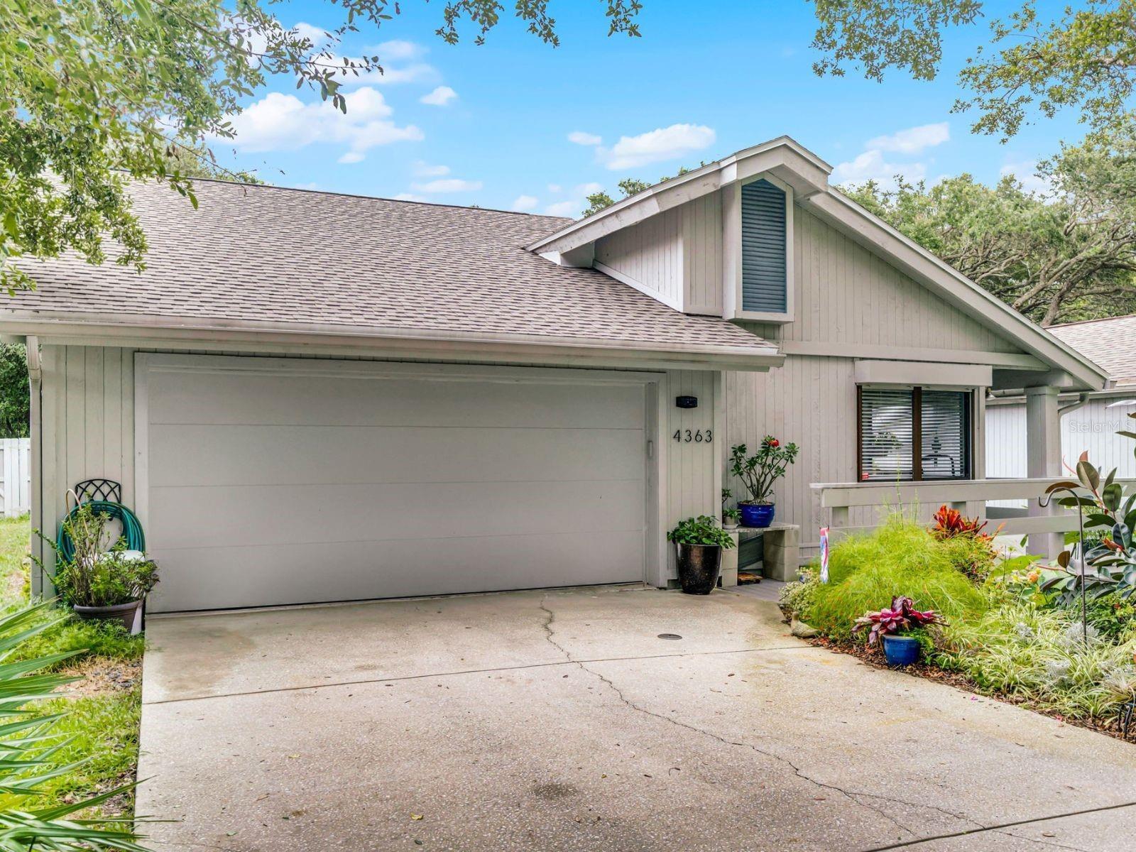FULLY UPGRADED BEACHSIDE RETREAT WITH 2023 ROOF & MORE! Step outside and experience the ultimate outdoor upgrade—a BRAND-NEW Trex deck and walkways, along with a NEW VINYL FENCE installed in July 2025, creating the perfect space for relaxation or entertaining. This home is absolutely packed with high-quality improvements, headlined by a NEW ROOF (2023), NEW gutters with LEAF GUARDS, blown-in attic insulation, and ROLL-DOWN HURRICANE SHUTTERS for peace of mind and energy efficiency. Located in Sea Woods—where LOW HOA FEES, $133/month, unlock a world of AMENITIES including THREE COMMUNITY POOLS, two tennis courts, and five pickleball courts—this home is ideal as a full-time residence or a coastal getaway. The fully finished 2-CAR GARAGE has been transformed with NEW FLOORING, CUSTOM CABINETRY, a NEW GARAGE DOOR & OPENER, and an EV CHARGER—ideal for today’s electric vehicle owners. Inside the home is an updated 3-bedroom, 2-bath home in the highly desirable Sea Woods HOA—just steps from the serene, non-drive beach. Tucked away at the end of a quiet road, the home offers rare privacy and a peaceful, nature-filled setting. You’ll enjoy a bright, open floor plan that allows for a full view of the living spaces the moment you walk in. The updated kitchen features stainless steel appliances, a stunning Walnut Boos Island countertop, and striking modern light fixtures. Warm luxury vinyl flooring runs throughout, and vaulted ceilings in the living room provide a spacious, airy feel, all overlooking your private, wooded backyard. The generous primary suite includes a renovated ensuite bath. MOVE-IN READY and truly TURNKEY—don’t miss this rare opportunity! Schedule your private showing today.