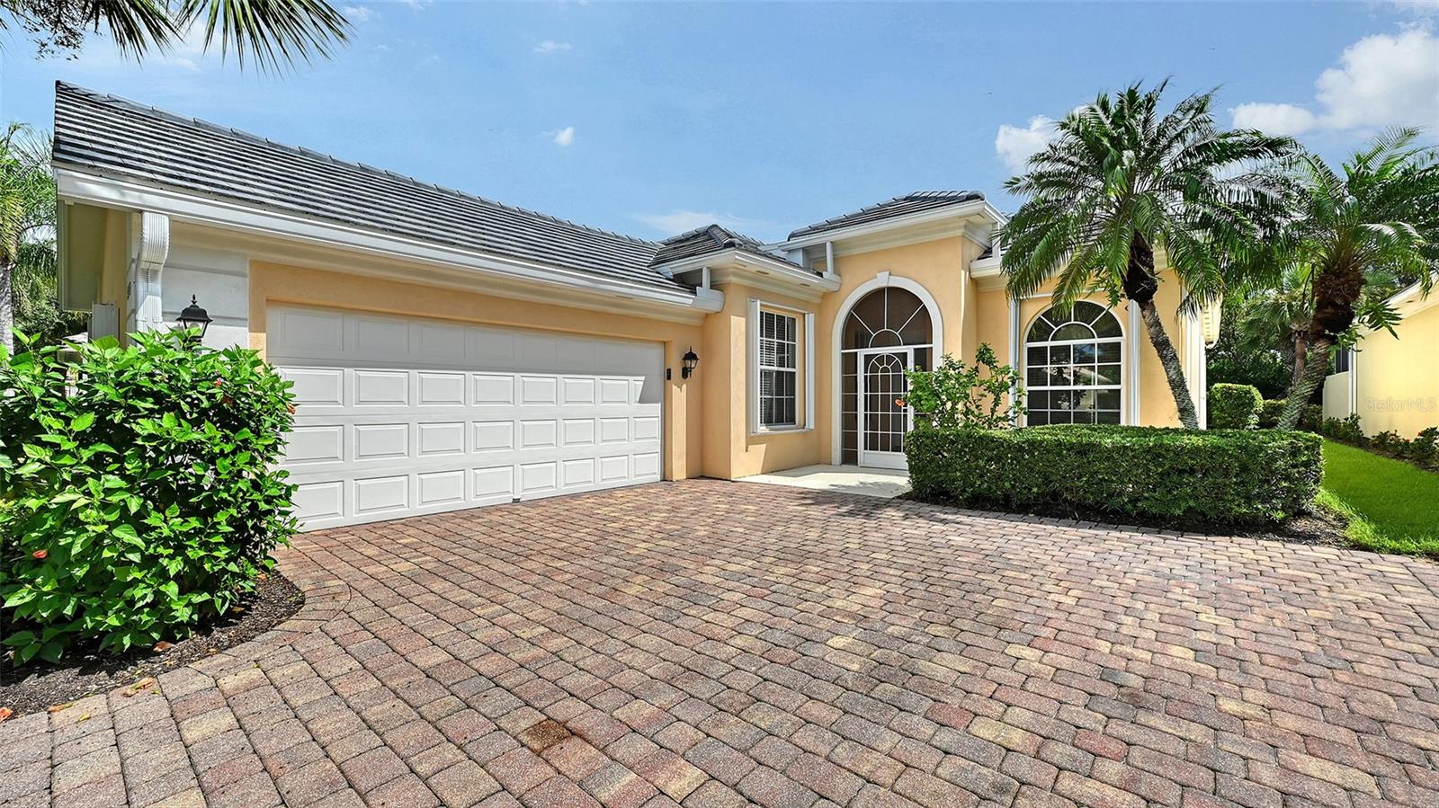 One or more photo(s) has been virtually staged. A NEW ROOF! Fantastic Oakmont Floor Plan with 3 bedrooms, 2 baths and Florida room with two ceiling fans and hurricane Impact Sliders, providing daylight & egress during storms. All other Doors and WIndows have accordion Shutters. This beautiful open floor plan is loaded with extras and features tile throughout (No Carpet), Crown Molding, Freshly painted throughout, Built in Book Cases in Den, Granite Countertops in Kitchen with Pot Drawers for easy access, Culligan Water Purification System in Kitchen, Lennox 3.5 Ton, 15 Seer A/C (2015) with new expanded duct work. Lanai floor has been freshly Painted and Hot Tub refreshed. All you have to do is Move IN! Village Walk is a wonderful unique community, built hurricane safe with poured concrete walls and foundations. Every home in Village Walk is considered to be a Single Family Home, roofs are tied down to the structures, per the Florida Building Codes and considered to be above average. Inspectors, roofers and Insurance agents that are familiar with Village Walk will share this information with you. Village Walk is in Flood Zone X, an area that is determined to be outside the 1% and 0.2% chance of flooding. FEMA updated, 8/2/24. Flood Zone provided by Sarasota County Tax reports. Evacuation zone D, flood insurance is not mandatory, but flood insurance is available. Village Walk power lines are underground with a Sarasota Fire Department just down Honore. Seldom losing power. Amenities include 24 hr guarded gate, geo-thermal heated and cooled lap & lagoon pools, six Har-Tru Tennis courts, Pickle ball, Bocce' ball and Basketball courts, State of the Art fitness Center, Miles of walking and bike paths, over 500 acres of lakes and preserves. There are over 50 activity groups who meet daily, weekly, or monthly. Plus there is a full service Cafe with full service Bar, Gas Station, Barber shop/Hair Salon, and Gift Shop. A special NOTE is that Village Walk did not lose power during the hurricanes and there was No flooding. What a Fantastic Place to Call HOME!