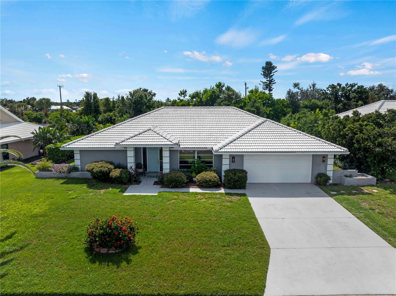 Welcome to this stunning home in the rarely available optional golf community of Plantation Golf & Country Club. From the moment you arrive, you’ll be captivated by the stylish updates and thoughtful design that make this residence move-in ready. This home is in a NON flood zone. Have a Tesla or EV vehicle? This home is already equipped with EV charging capabilities.
Step inside to a bright, open-concept floor plan featuring gorgeous new porcelain tile flooring that flows seamlessly throughout the entire home. With 3 spacious bedrooms—each with walk-in closets—and 2 beautifully remodeled bathrooms, this home offers both comfort and sophistication. Spacious oversized 2 car garage affords you plenty of room for storage.
At the heart of the home is the oversized open kitchen, designed for entertaining and everyday living. Featuring a large island, white quartz countertops, premium cabinetry, and top-of-the-line GE Profile stainless steel appliances, it’s a chef’s dream. The split bedroom layout provides a private retreat in the primary suite, where you’ll find a spa-like bathroom complete with dual vanities, a walk-in shower, and a freestanding soaking tub.
Walls of sliding glass doors invite natural light inside and extend your living space effortlessly to the outdoors. The kitchen has a beautiful newly installed hurricane impact sky light.
Plantation Golf & Country Club offers an exceptional lifestyle with optional social or golf memberships, casual and fine dining, a welcoming lounge, swimming pools, tennis courts, fitness center, and a championship golf course.
This home is truly move-in ready for anyone with discerning taste—unpack your bags and start enjoying the Florida lifestyle today! Schedule your private showing today!