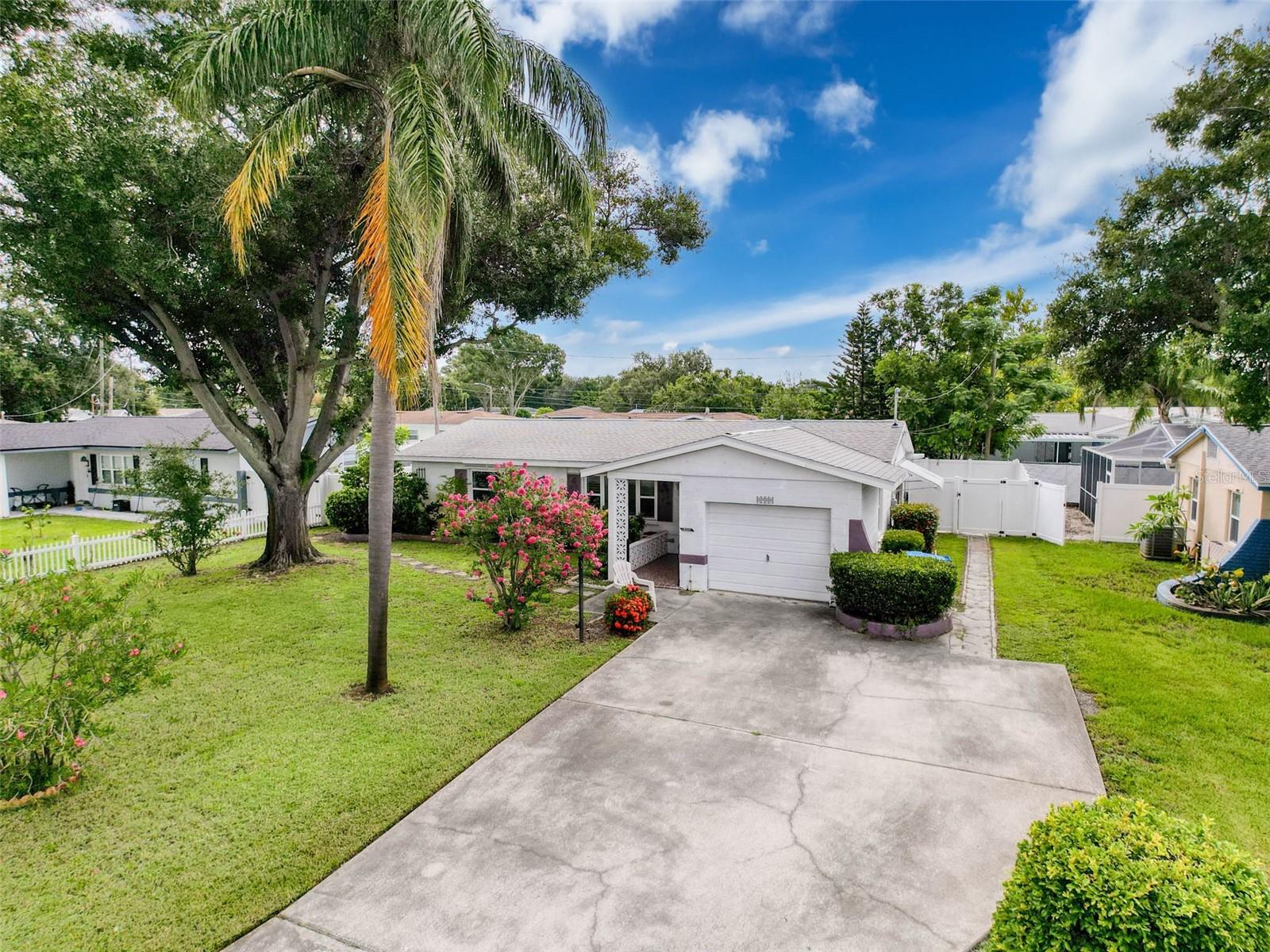 Welcome to this beautifully remodeled two-bedroom, two-bathroom home that perfectly blends modern updates with comfort and privacy. Centrally located near the beach, hospitals, and entertainment, this property offers both convenience and style. A six-foot vinyl fence, completed in 2023, ensures privacy while the inviting sunroom with its own mini split and brand-new porcelain tile installed in 2025 provides additional living space to enjoy year-round. Inside, luxury vinyl plank flooring installed in 2023 flows seamlessly throughout, complementing the updated kitchen featuring 2023 Frigidaire appliances, new cabinets, and elegant quartz countertops. The primary bathroom has just been remodeled, while the secondary bathroom was fully updated in 2023, offering a fresh and modern feel. Additional upgrades include a 2024 tankless water heater, 2023 electrical panel, blinds installed in 2023, and a 2019 AC system. The roof, completed in 2017, is equipped with AV hurricane tie downs for added peace of mind. With no HOA, this move-in ready home combines functionality, style, and a highly desirable location.