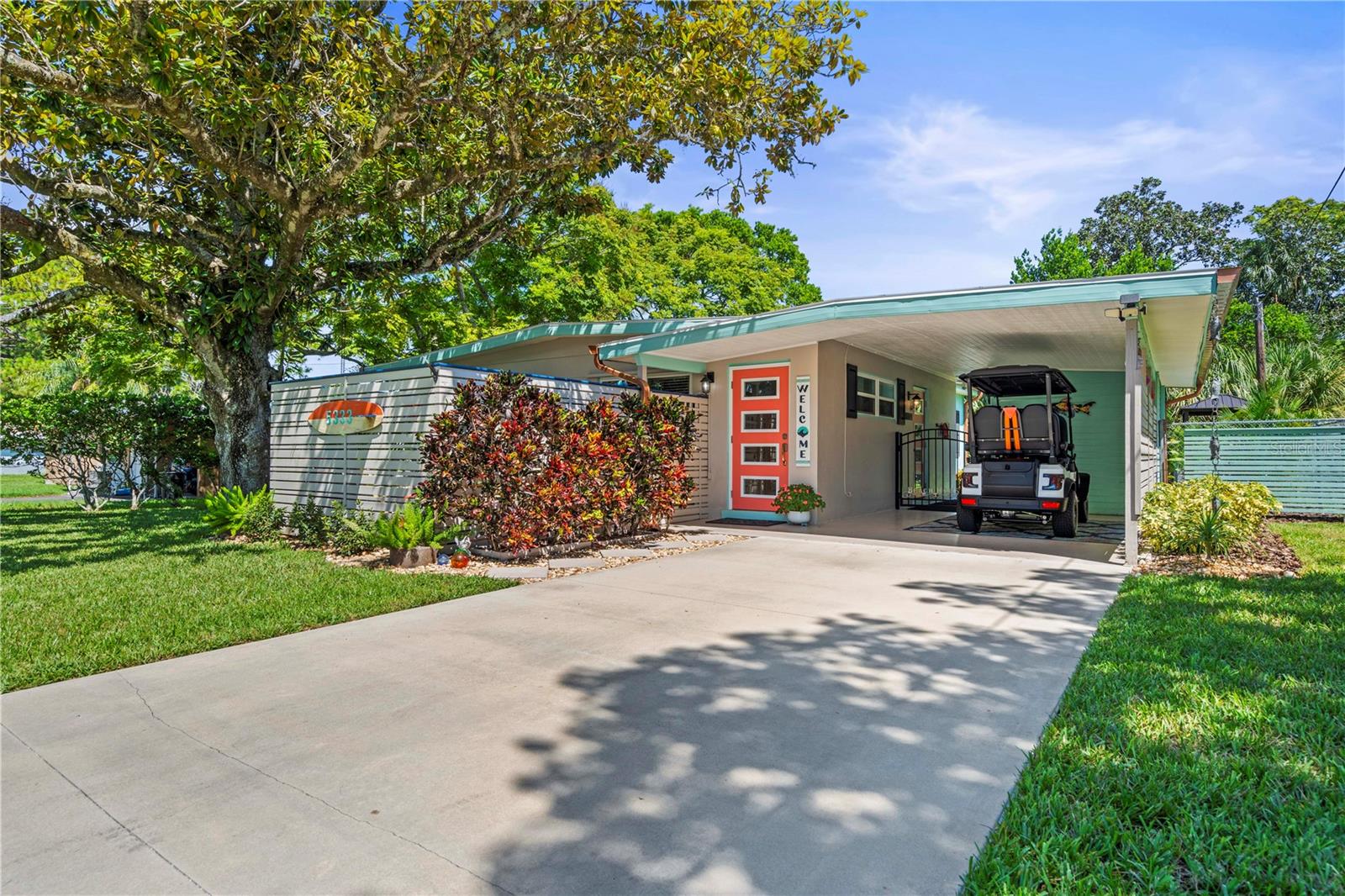 Welcome to your very own slice of paradise in New Port Richey, just minutes from the charm of downtown. This beautifully designed Key West–inspired 2-bedroom, 1-bath home combines comfort, character, and lifestyle — perfect for first-time buyers, a young couple, or investors looking for the ultimate Airbnb or vacation rental opportunity.
From the moment you arrive, the property stands out. A long driveway, shaded by a stunning mature tree, leads you to a vibrant entryway with a gated patio that feels like your own private beach retreat. The colorful front door and tropical touches immediately set the tone for what’s inside.
Step into a warm and inviting living room that flows seamlessly into the kitchen and dining areas. The kitchen boasts stainless steel appliances, beautiful cabinetry, and a custom backsplash that adds personality and style. Just off the kitchen, the dining room shines with natural light, making it the perfect place to enjoy meals and gatherings.
The home features two well-appointed bedrooms, a beautifully updated bathroom with modern tile, and one of the most fun and functional laundry rooms you’ll ever see — bright, themed, and full of coastal character, turning everyday tasks into a lighter experience.
Outside, the backyard is where this home truly shines. Enjoy a dedicated grilling area, a tiki-style seating spot under the palms, and a sparkling pool to cool off during Florida’s sunny days. A nautical-inspired red shed adds extra storage or could be reimagined as a creative space. Every corner of the yard is thoughtfully designed to make you feel like you’re on vacation.
This home isn’t just a place to live — it’s a lifestyle. Whether you make it your own tropical retreat or transform it into a standout short-term rental, the possibilities are endless.