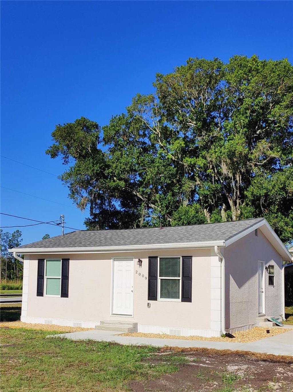 Photo of 2009 Henley Road, Lutz, FL 33558 (MLS # W7882505)