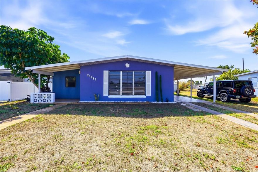 Welcome to 21283 Midway Blvd in Port Charlotte, Florida—a well-located 2-bedroom, 1.5-bathroom home offering functional living space, recent major updates, and flexible potential. The property includes a carport and an attached outdoor laundry and storage area for added convenience and is located in an X-flood zone. Inside, the home features two comfortably sized bedrooms along with a bonus room that can be utilized in a variety of ways. The primary bedroom includes a private half bathroom, while a full bathroom with tub is located in the hallway. The layout offers practical separation of living and sleeping areas. Recent improvements include a new roof (2021) and new HVAC system (2020), providing important system updates. Centrally located, this property provides easy access to shopping, dining, parks, medical facilities, and major roadways, making everyday errands and commuting simple. With its combination of updates, location, and layout, this home presents an opportunity for buyers seeking a residence with room to personalize.