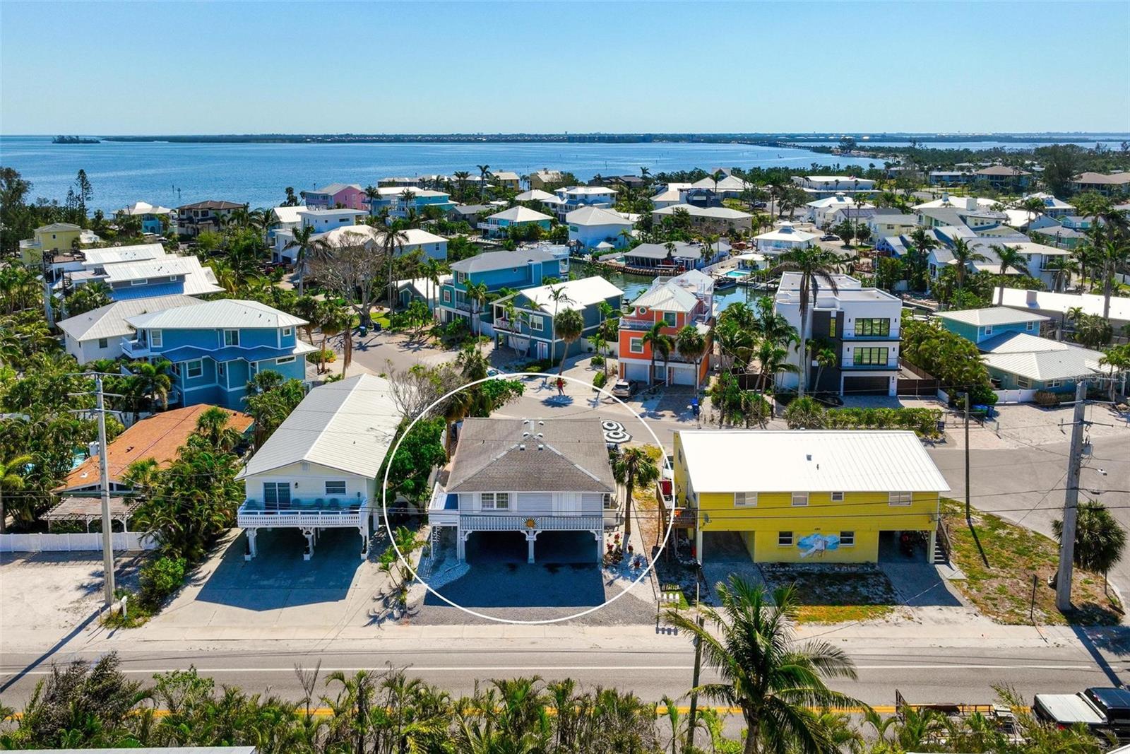 Elevated Turnkey Furnished Duplex on Anna Maria Island in a short-term rental zone! Nestled just a few blocks from the powdery sands of Holmes Beach, this elevated duplex presents a unique opportunity in one of Anna Maria Island’s most desirable weekly rental zones. Ideally positioned for both personal enjoyment and investment potential, this property offers convenience and island appeal. The home features two well-maintained 1-bedroom, 1-bathroom units: Unit A at the front and Unit B at the rear. Each unit is equipped with hurricane shutters and its own private laundry/storage area located beneath the home in the carport area. Never before part of a rental program, both units reflect pride of ownership and a deep appreciation for the island lifestyle. Enjoy easy access to the beach, restaurants, boutique shops, and the vibrant downtown Holmes Beach district — all within a short stroll or biking distance. The free island trolley is also just steps away, offering a fun and easy way to explore everything Anna Maria Island has to experience. A shared outdoor living space adds to the relaxed atmosphere, making this property perfect as a personal retreat, a seasonal getaway, or an income-generating rental. Both 1BR/1BA units reflect the residents' pride and joy in the Island living and lifestyle and has never been in a rental program. Whether you're seeking a tranquil beachside haven or an investment in a high-demand vacation area, this elevated duplex is a true island gem and rare opportunity in Holmes Beach.