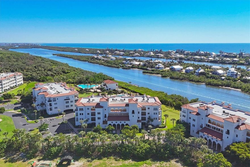 Experience refined coastal living in this beautifully remodeled 3-bedroom, 2.5-bath corner unit in the coveted southern-facing Building "C" of Hacienda Del Mar. Bathed in natural light from numerous east-facing windows, this mint-condition property showcases a fresh coastal design with brand-new wide plank flooring throughout the living and bedroom areas, fresh interior paint, and tile backsplash.  The open-concept floor plan seamlessly blends the expansive kitchen, dining, and living spaces, all anchored by elegant stone countertops, creating an inviting and impressive setting for everyday living and entertaining.  Step outside to enjoy truly exceptional outdoor living. The immense screened lanai features a stunning built-in outdoor kitchen, while a private terrace off the guest bedrooms offers a peaceful retreat.  Built to the highest standards, this residence boasts Andersen impact-resistant windows and sliders, storm shutters, a richly stained Thermatru front door, soaring 10-foot ceilings, and 8-foot solid core interior doors. Enjoy picturesque views of the Intracoastal Waterway and convenient access to two resort-style swimming pools, a luxurious waterfront clubhouse, spa, tennis and pickleball courts, day dockage, and Palm Harbour Marina.  Ideally located near top-tier shopping, fine dining, public and private golf courses, world-class fishing and boating, and the charm of historic Boca Grande. Most of the nearly-new furnishings are negotiable, move in and start enjoying paradise today.