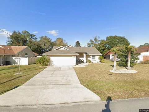 Photo of 104 Westrobin Lane, Palm Coast, FL 32164 (MLS # FC317047)