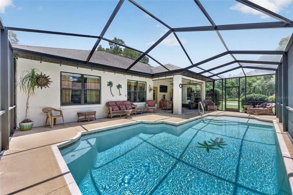 Photo of 19331 SW 100th Loop, Dunnellon, FL 34432 (MLS # OM728672)
