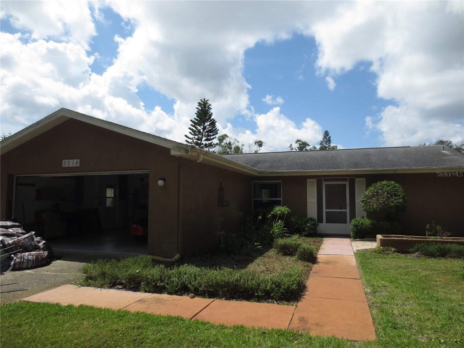 Highland Lakes community offering tons of activities to include olympic sized pool, hot tub, no greens fee 27 hole golf course, bocce, tennis, shuffleboard, club house, auditorium, dinners & dances, wood shop, ceramics & art studio, RV & boat storage and access to Lake Tarpon. Immaculate single family, one story, 2 bedroom, 2 bath, 2 car garage home. Newly renovated kitchen with quartz countertops, walk in closets in both bedrooms, solar panels keeping electric bill average around $31 a month, full house automatic propane generator, ceiling fans in all rooms, Florida room with separate mini AC unit and laminate flooring throughout. Situated near schools, churches, shopping centers and major thoroughfares.