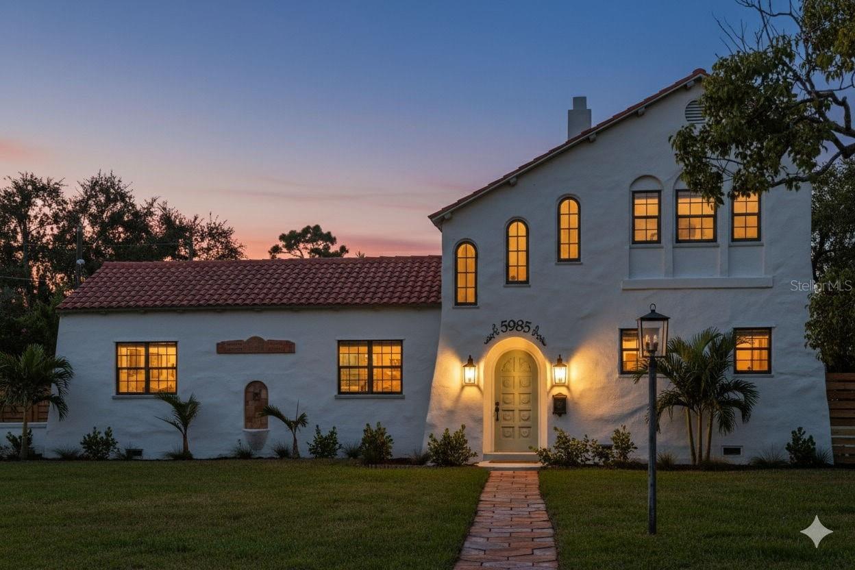 "History Preserved, Beauty Reimagined" - This 1920s Spanish-inspired architectural gem in West St. Pete is believed to have been built by “Handsome Jack” Taylor, the visionary developer behind the famed Hotel Rolyat (now Stetson College of Law) and the Pasadena Yacht & Country Club. Set on an estate-sized lot of over one-third acre, the home commands attention with its timeless presence. Original clay bas-relief artwork, Spanish tile accents, and a charming fountain grace the exterior, evoking the elegance of a bygone era. Inside, a spectacular two-story vaulted ceiling welcomes you into the great room, anchored by one of three original fireplaces. With over 1,900 sqft of living space, this residence offers 3 bedrooms and 2.5 bathrooms. The sweeping staircase leads to the oversized primary suite with a cozy sitting area, fireplace, and private en suite bath. Historic details shine throughout, from arched doors and carved niches to a hidden storage door beneath the main staircase. Thoughtful renovations blend modern convenience with historic integrity. The kitchen has been reimagined to honor the home’s original character, while gleaming hardwood floors have been preserved. Outside, a brand-new pool creates the perfect canvas for reimagining the backyard into your own private tropical oasis, ideal for relaxation or entertaining in the Florida sunshine. Perfectly located in West St. Pete, the property provides easy access to Gulf beaches, shopping, and dining along Central Avenue, and the vibrant Downtown St. Pete scene. Situated in Flood Zone X, no flood insurance is required. This is a rare opportunity to own and steward a piece of St. Pete’s rich history, where old-world craftsmanship meets timeless Florida living.
