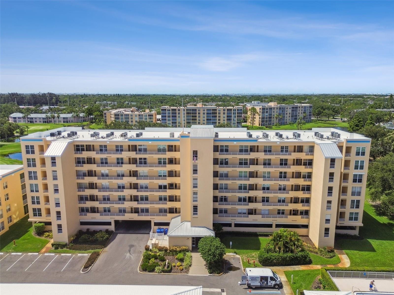 Price improvement in The Fairways at Pinebrook. There are no special assessments owed as all major projects are complete. There are no extra fees for living on the golf course. You can lease/rent the unit if needed without an ownership waiting period. Featuring a modernized and fully furnished split 2-bedroom, 2-bathroom condo with direct sweeping 6th top floor views of Pinebrook Ironwood Golf Course. This building #9 has the desirable underbuilding parking garage. The Fairways have their own exclusive pool and patio lounging deck. You also have access to the east side Pinebrook Clubhouse with a heated pool, billiards, a banquet hall for large gatherings, a huge kitchen, workshop, ping pong, outdoor grilling area and a tennis pickle ball court across the street. This unit is loaded with updates. The windows are now high-impact insulated replacements. The modern exterior lanai sliders are dressed with solar shade pull-down window treatments. The eat-in kitchen is fully remodeled with an open concept featuring custom cabinets dovetail fastened drawers and soft-close hardware, a lazy Susan, a built in pantry cabinet, over-under cabinet lighting and ceiling track lighting. The countertops are granite with a tile backsplash and the appliances are stainless steel GE Profile. The living room features crown moldings, 5-inch baseboards and carpets in both the living room and bedrooms. Both bathrooms have multiple updates as well. The primary suite accommodates a king-size bed and features an 8x7 walk-in closet. This unit also comes with a 7x7 utility room with a washer/dryer and extra cabinets for storage. The storage locker is down the hall by the elevator. New in 2023 the building roof, exterior caulking, painting, the parking lot repaved and the elevator mechanicals updated. The low monthly condo fee of $583 covers just about everything. Pinebrook is conveniently located close to medical facilities, shopping, restaurants, Robinsons Preserve, GT Bray Park and the beaches of Anna Maria Island. Being sold "AS IS" Furnished, with buyers right to inspect. A few personal items do not convey.