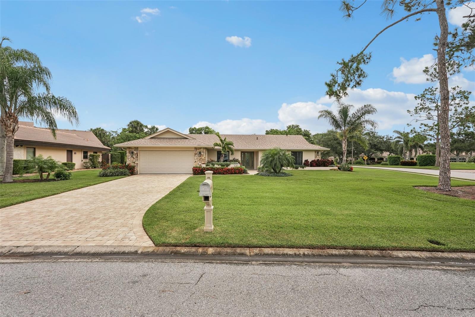 Welcome to your dream home at 5283 Everwood Run, nestled on an expansive oversized corner lot of over 16,000 square feet. This beautifully updated two-bedroom, two-bathroom plus den residence offers a perfect blend of luxury and comfort in the heart of Sarasota. Enjoy breathtaking views of the Meadows Golf Course's 13th hole and 14th tee from the inviting pool area, making this property a true oasis for golf enthusiasts and nature lovers alike. This charming home features a versatile office or den that can easily serve as a potential third bedroom, providing ample space for family and guests. Recent renovations and upgrades include a newer roof equipped with upgraded hurricane tie-down straps and impact-resistant windows and doors, including the garage door, which significantly reduce homeowners’ insurance costs. The property boasts owned solar panels installed on the rear roof, ensuring lower energy costs with an existing FPL agreement. Additionally, new blown-in R30 attic insulation was added in 2024 for enhanced energy efficiency, and the exterior and interior have been freshly painted, complemented by new exterior lighting. The elegant paver driveway and front walkway enhance the home's curb appeal. Modern amenities abound, including a whole house water softener and treatment system installed in 2024 for improved water quality, as well as a reverse osmosis water treatment system in the kitchen for pure drinking water. Solid maple flooring throughout the living areas provides a warm and inviting atmosphere. The renovated kitchen, dining, and living areas have been thoughtfully redesigned to create an open floor plan that overlooks the sparkling pool, perfect for entertaining and family gatherings. The guestroom has been reconfigured to provide a second ensuite bedroom for added convenience. Recent upgrades also include the complete removal of popcorn ceilings with a smooth skim coat plaster finish, new recessed lighting, and a fire protection system. New interior solid shaker-style doors, trim, and hardware, along with new 5-inch high baseboards throughout the home, add to the modern aesthetic. The new HVAC system with UV light protection installed in 2022 and the water heater replaced in 2024 ensure worry-free living. Step outside to discover your outdoor paradise, featuring a newly installed pool and lanai cage completed in 2024. The updated and sealed pool pavers, along with a new pool heater and high-efficiency pool filter, ensure your pool is ready for year-round enjoyment. This meticulously maintained home is not just a residence; it’s a lifestyle. Don’t miss the opportunity to make this exceptional property your own. Schedule a private showing today and experience the perfect blend of luxury, comfort, and stunning views at 5283 Everwood Run!