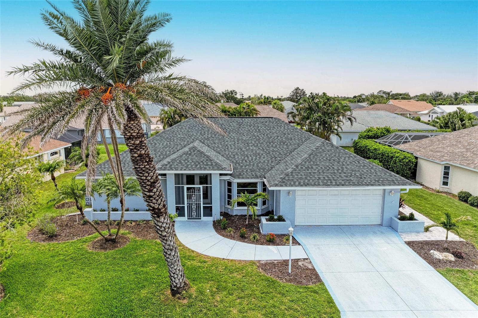 Imagine waking up with sunlight pouring through the sliders, your private pool glistening just beyond — coffee in hand, a gentle breeze, and nothing on your to-do list but enjoy another perfect Florida morning.
Welcome to 5832 Garfield Road, a beautifully renovated 3-bedroom, 2-bath pool home in Gulf View Estates — a quiet, deed-restricted community just 3 miles from Manasota Beach, with no CDD and only $325/year HOA.
The home features a split floor plan, vaulted ceilings, and an open-concept layout that flows from room to room. The kitchen has been completely updated with new shaker cabinetry, quartz waterfall countertops, and stainless appliances — all installed in 2023. Adjacent to the kitchen is a spacious family room and passthrough window to the 21’ covered lanai, ideal for entertaining.
Every bedroom includes a walk-in closet, with the primary suite offering sliders to the pool, dual closets, and a fully redesigned bath featuring double vanities, a walk-in shower, and a freestanding soaking tub backed by a stunning tiled wall.
Natural light fills the home through multiple sliders and large windows, all protected by hurricane shutters, with views stretching to the private screened pool area — updated with a brand-new roof and cage in 2025.
Additional highlights include:
• Luxury vinyl plank flooring and new lighting throughout
• Indoor laundry room
• Lush, low-maintenance landscaping
• Not located in a flood zone
This home blends modern comfort with laid-back Gulf Coast living. Just minutes from Wellen Park, downtown Venice, and world-class beaches — don’t miss your chance to own a slice of paradise.