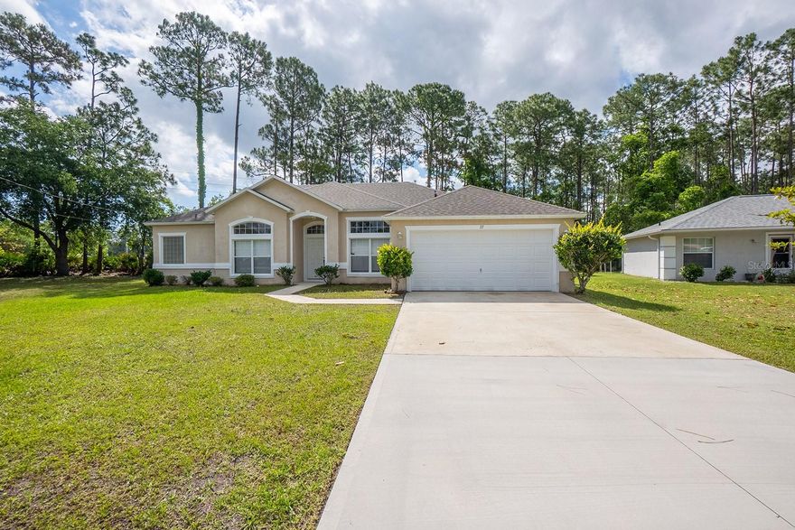 Spacious and well-designed home located in the desirable Lehigh Woods of Palm Coast. This property offers a functional layout with a formal living room and dining room, plus a separate family room, providing flexibility for everyday living and entertaining. The large kitchen features ample cabinet space, a full-size pantry, and a dedicated breakfast area. The primary suite includes two walk-in closets, a garden tub, and separate shower, creating a comfortable and practical retreat. Additional features include a laundry room with washer and dryer hookups, two-car garage, and a covered back porch measuring approximately 22x10, ideal for outdoor gatherings and relaxation. The spacious backyard offers plenty of room for outdoor enjoyment. Conveniently located near shopping, dining, and major roadways, with approximately a 15–20 minute drive to Flagler Beach, offering easy access to coastal living while enjoying the benefits of an established residential neighborhood.