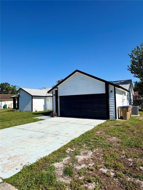 Photo of 303 Silk Oak Dr, Kissimmee, FL 34743 (MLS # O6408237)