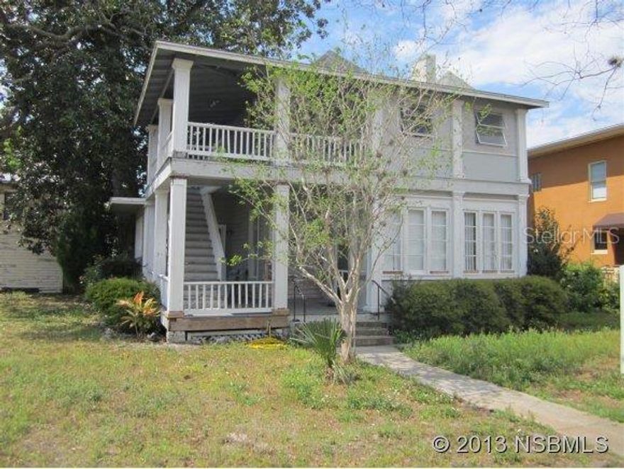 With Mixed Use Zoning this historically contributing structure located in the heart of New Smyrna Beach's downtown offers a multitude of opportunities. Main duplex structure houses a 2-bedroom/2-bath unit on the ground floor and a 2nd-story 2-bedroom, 1-bath unit. Detached concrete block garage apartment houses a studio unit and long-term tenant. Close proximity to Bert Fish hospital. Considerable restoration is needed to maximize value of this historical diamond in the rough. ;Water: City