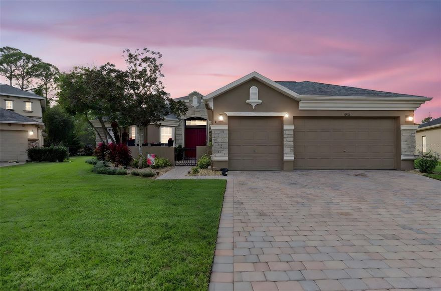 Crowd pleaser located one of Oviedo's popular communities- The Sanctuary. Come enjoy the benefits of a peaceful and friendly community with well-manicured grounds, plenty of wildlife and a welcoming atmosphere. Sit back and relax in this immaculate home offering an open floor plan and desirable location. There’s plenty of space to enjoy everyday living & casual entertaining inside & outside and with generously sized bedrooms plus quality finishes, everyone will find something they love in this home. Too good to be true with a brick paver driveway, walkways and pretty landscaping welcoming you to a nice lot with calming views. Fully fenced privacy. You're invited to enjoy a new chapter of serenity. Enjoy everyday living & entertaining in this open & generously sized 3 bedroom, 3 bath with an office/study and a 3 car garage with a pool offering 2,574 sq. ft. The kitchen boasts 42" cabinets, Corian countertops, large closet pantry, breakfast bar and large eat in nook. The family room opens to the kitchen and is light and bright due to the sliders allowing natural light in and creating a cozy atmosphere for entertaining in your covered porch. In addition this home offers three nicely sized bedrooms and ensures ample personal space for everyone to work, play & rest. A large outdoor patio with a salt water pool - all yours to enjoy privately or with a crowd. Sit on your porch, have a glass of wine and listen to the birds sing. The master retreat is nicely sized creating a comfortable sitting area with bright windows overlooking the sparkling pool and offers two large walk in closets. Spacious master bathroom with dual vanities, a separate shower and a large luxurious soaking tub. The guest wing features 2 large bedrooms each having a bathroom of their own. Extras to include; a relaxing hot tub, and for the golf enthusiast improve your game on your 350 sq ft putting green and the home comes equipped with hurricane shutters. Beautifully professional landscaing This community boasts all A+ schools and is sure to please a crowd being close to major highways, UCF, lots of shopping and delicious restaurants. Conveniently located in a fabulous community with an oversized swimming pool, splash pad, fitness center, basketball courts and pickleball. See this beautiful, move-in ready, model home & enjoy Florida style living at its best!