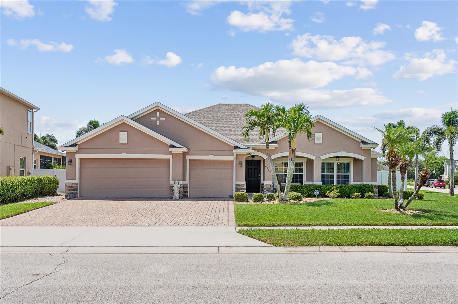 Welcome to your dream home! This stunning builder's model home, situated on a fully fenced corner lot, offers an impressive array of luxurious features. With four generous bedrooms and two full baths, it provides ample space for families seeking comfort and style. The gorgeous screened-in saltwater pool offers a perfect oasis for relaxation and entertainment. The three-car garage, with one bay transformed into a versatile, air-conditioned room, is ideal for a workshop or an additional bedroom. The home is bright and airy, thanks to vaulted ceilings and an open floor plan that fills it with natural light, creating a welcoming atmosphere. Culinary enthusiasts will love the spacious kitchen, which is perfect for cooking and entertaining. Enjoy outdoor living on the large, covered patio, ideal for dining and hosting gatherings. Modern upgrades include a roof replacement in 2018 and brand-new carpets with luxury plush padding in all bedrooms for added comfort. Convenience is assured with all appliances and a water softener included, ensuring a seamless move-in. Located in a prime area with easy access to the Florida Turnpike, this home offers connectivity to all the amenities you desire. Don’t miss the chance to own this exceptional property. Experience luxury living at its finest in this beautifully appointed home. Contact us today for a private showing and make this dream home yours!