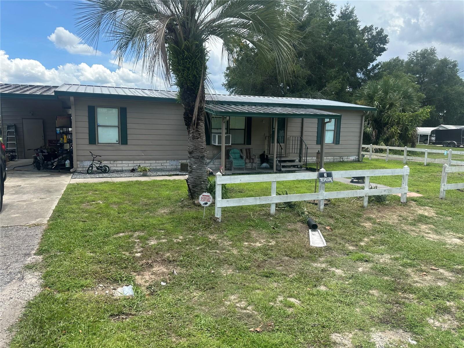 All the hard work has already been done here!!! New heat and Air Conditioning, new hot water heater, metal roof, bathrooms re-done, all new flooring, new lateral lines, newer septic. This three bedroom two bath home is ready to be lived in. It also has a 10 x20 Lanai that is being used for storage at the moment but, can be used for a bedroom if you need it. It does have a window air unit. The pictures show window air units but, it has new central heat and air. The generator will run the window units if you lose power during a storm. A brand new above ground pool in the back yard will help you relax in the evenings after a hard day at work. Hurry and make your appointment at this price it will sell quick.