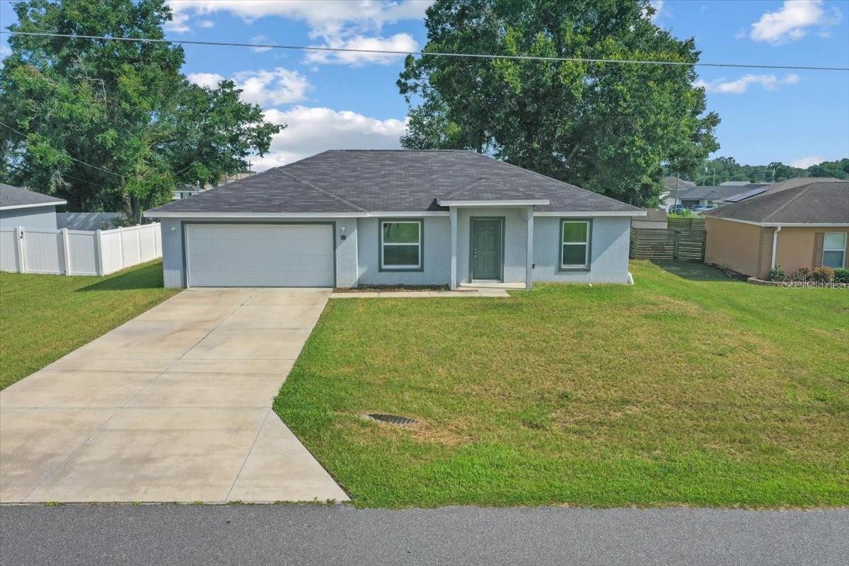 Step into this beautifully maintained 3-bedroom, 2-bathroom home, perfectly designed with a split bedroom plan for added privacy. Built just 5 years ago, this home features luxury vinyl flooring throughout the main living spaces.
The spacious open floor plan is enhanced by vaulted ceilings, creating a bright, airy feel. The kitchen has granite countertops, an island, dark colored cabinetry, and a seamless flow into the dining and living areas—perfect for entertaining. The property also features a covered front porch and the convenience of a 2-car garage with plenty of storage space. The primary suite features a private bath and walk-in closet, while two additional bedrooms provide flexibility for family, guests, or a home office.
Located in a desirable area, this move-in-ready home offers the perfect combination of modern design and comfortable living. Don’t miss your chance to make it yours!