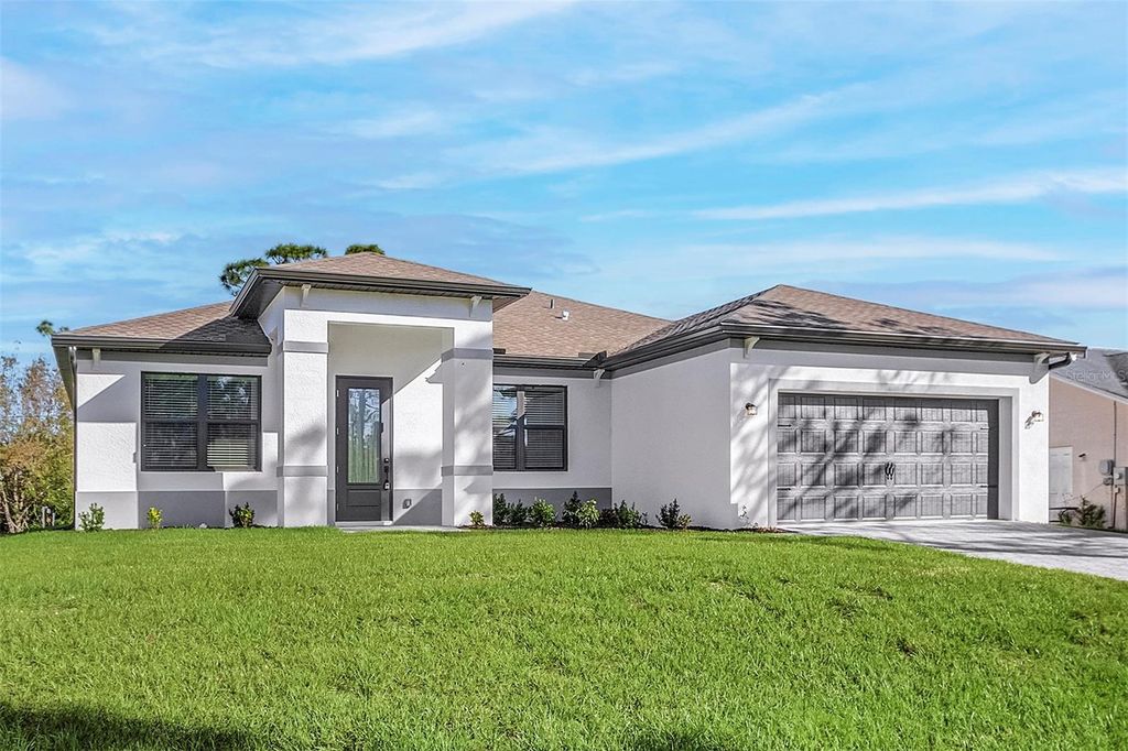 Photo of 5025 White Avenue, Port Charlotte, FL 33981 (MLS # TB8454246)