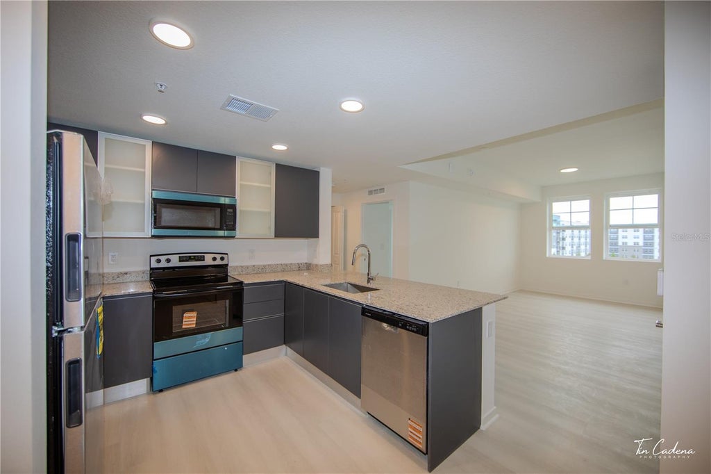 Photo of 5563 Millenia Park Blvd #317, Orlando, FL 32839 (MLS # O6447534)