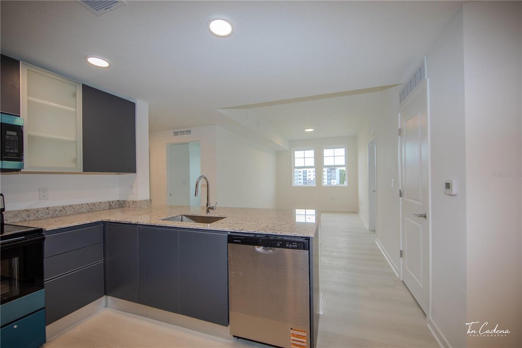 Photo of 5563 Millenia Park Blvd #317, Orlando, FL 32839 (MLS # O6447534)