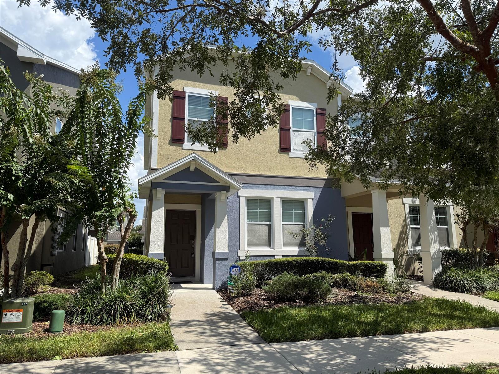 Townhome in Wickham Park. Light and Bright End Unit has Three Bedroom, Two and One Half Bath. Kitchen has 42" wood cabinets, stainless steel appliances, breakfast bar and opens to the living/dining area. First floor has ceramic tile, second floor with new carpet. Two Bedroom are connected with a jack and jill bath. Master suite with a double vanity and shower. Laundry closet is in the hallway. Private Courtyard leads to the two car garage. Community amenities include the clubhouse, pool, picnic areas, playground and more. Close to shopping, Disney, schools.