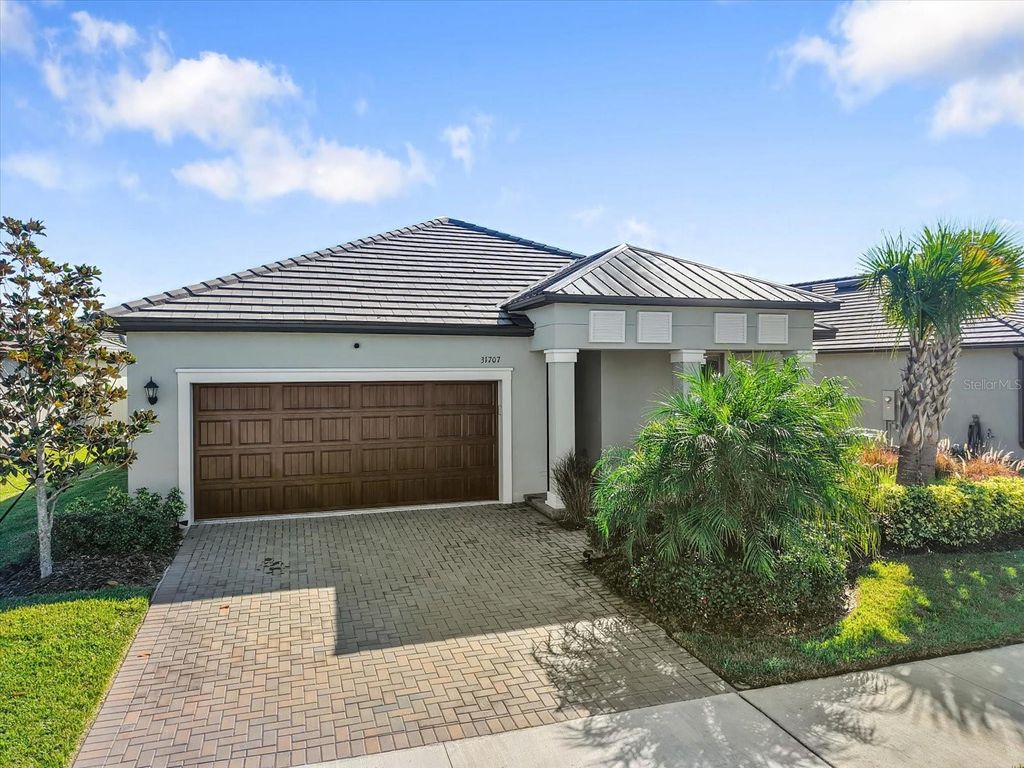 Photo of 31707 Magna Gulf Loop, San Antonio, FL 33576 (MLS # TB8440448)