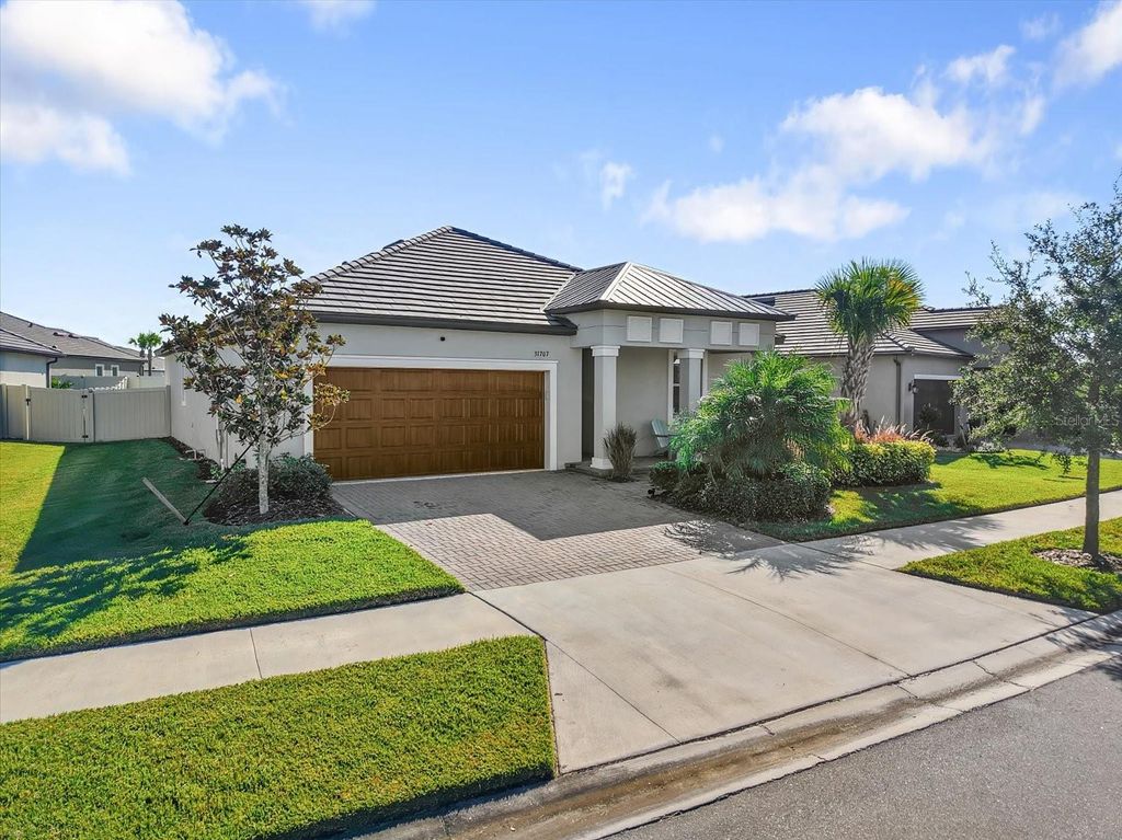 Photo of 31707 Magna Gulf Loop, San Antonio, FL 33576 (MLS # TB8440448)