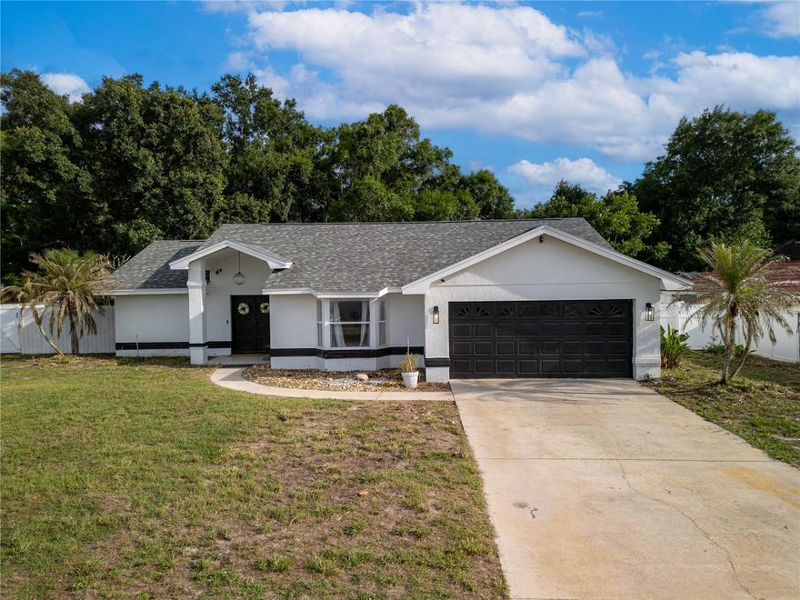 Move-in ready and priced to sell! Located in a quiet, neighborhood with a low HOA of just $200 annually, this beautifully updated 3-bedroom, 2-bath home offers exceptional value, major system updates, and endless potential on a spacious quarter-acre lot.

Step inside to discover an inviting open-concept layout where the living room, dining area, and kitchen flow seamlessly together, creating the perfect space for both everyday living and entertaining. The updated kitchen features modern cabinetry, updated fixtures, appliances, and a center island that serves as the heart of the home. Luxury vinyl plank flooring throughout provides a clean, cohesive look and easy maintenance.

Designed with privacy in mind, the split-bedroom floor plan offers a spacious primary suite separated from the guest bedrooms. Every bedroom features a walk-in closet, providing ample storage throughout the home. A large Florida room adds valuable additional living space and connects the home’s interior, making it ideal for a home office, playroom, gym, media room, or second living area.

Outdoor living is where this property truly shines. Situated on approximately a quarter-acre lot, the expansive backyard offers plenty of room to create your dream outdoor oasis, including space for a future pool. Enjoy peaceful views with acreage behind the property, providing added privacy and a more open feel than many neighboring homes. The 16x16 screened patio with a concrete slab is perfect for relaxing, entertaining guests, or enjoying Florida evenings year-round.

Major updates provide peace of mind, including a 2021 roof and 2021 A/C system. Originally constructed with a tile roof design, the home was built to support the additional structural load, contributing to its durability and long-term appeal. Additional highlights include a two-car garage, vinyl privacy fencing, updated appliances, modern fixtures, and thoughtful improvements throughout.

Offering a rare combination of location, lot size, recent updates, low HOA fees, and future potential, this property presents an outstanding opportunity in one of the area’s most desirable neighborhoods. Whether you’re looking for a move-in-ready home, additional space to grow, or a property with room to personalize over time, this home checks all the boxes.

Seller is motivated. Schedule your private showing today and discover everything this exceptional property has in store.