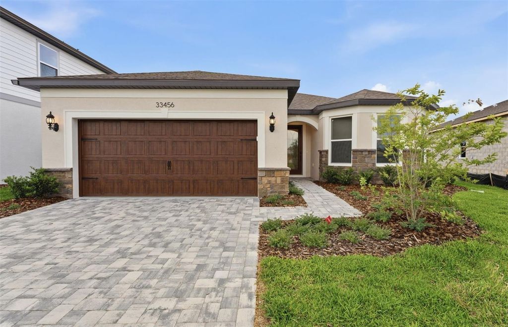 Photo of 33456 Herds Hallow Way, Wesley Chapel, FL 33545 (MLS # TB8469585)