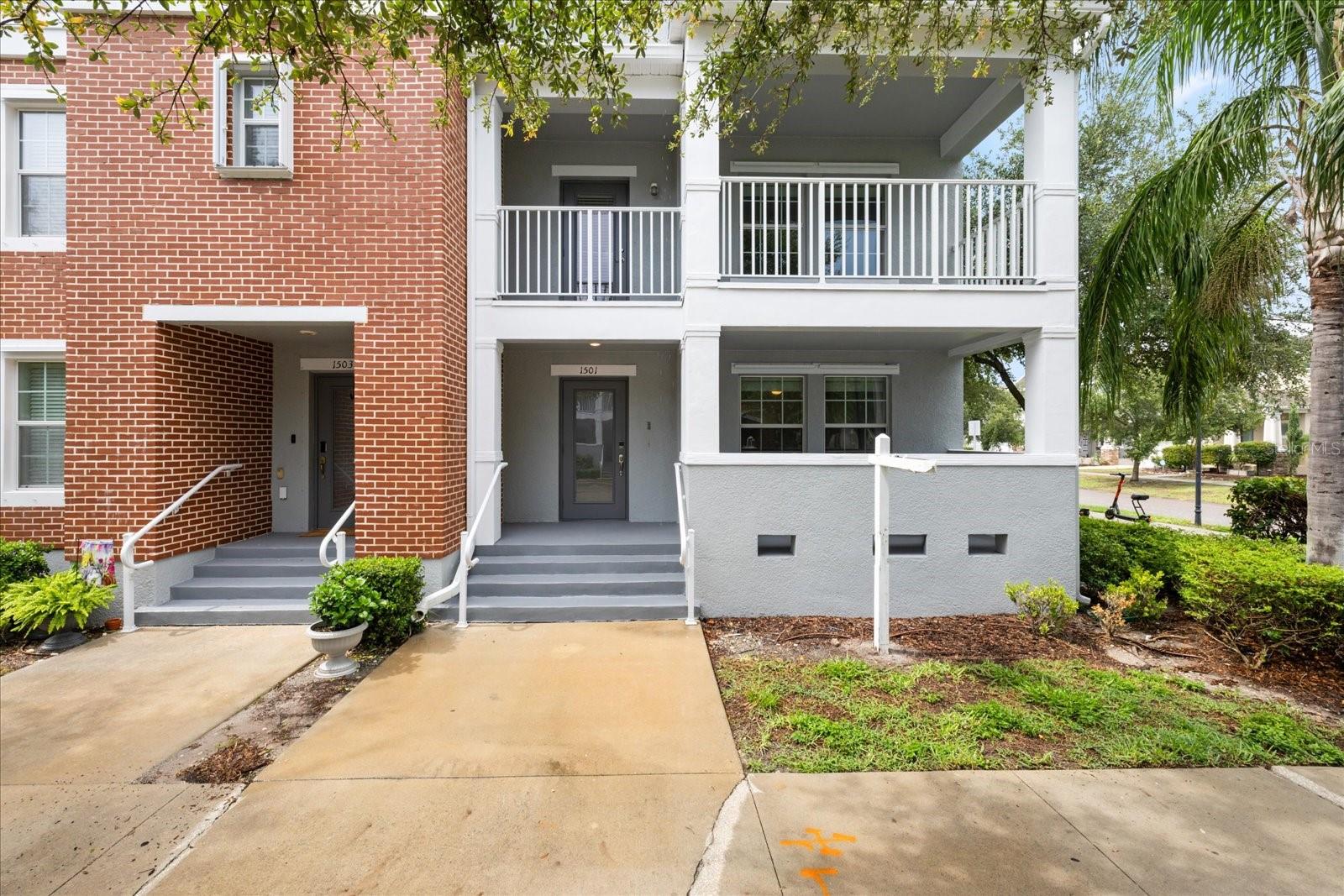 Spacious corner townhome with rare downtown skyline views, located in the heart of Tampa. This 4-bedroom, 3.5-bath residence features an open-concept main floor with hardwood flooring, a gourmet kitchen with a large center island, quartz countertops, wood cabinetry, and stainless steel appliances. The living and dining areas flow seamlessly, opening to a private balcony with city views. The ground level includes a private bedroom with a full bath and covered patio—ideal for guests or a home office—along with access to a two-car rear-entry garage. Upstairs, you'll find three additional bedrooms, including a spacious primary suite. Abundant natural light from the corner unit's south-facing windows enhances every level. Located in the coveted Plant High School district and just minutes from Bayshore Blvd, Downtown Tampa, Riverwalk, Hyde Park, and major highways for easy commuting.