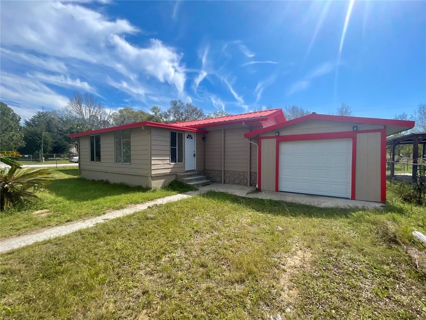 The home has been completely remodeled, and brand-new wood laminate flooring has been installed throughout the home to create a cohesive feel. The kitchen has new appliances and white cabinets, with beautiful granite countertops that provide a spacious area. It is easy to entertain company from the kitchen and to display food on the island for gatherings. Open concept from the kitchen, living room, dining room/den. This home has abundant space and many possible uses, such as supporting a large family or multi-generational family, and plenty of space for an office, game room, den, bonus room & potentially 5 bedrooms...the sky is the limit. The home sits on a corner lot, is fully fenced, and offers the benefit of a metal roof. Enjoy the lush landscaping with a couple of banana trees and palm trees. The spacious backyard offers a small shed and pet enclosure. The community can access a private boat launch to Lake Bryant with minimal fees.